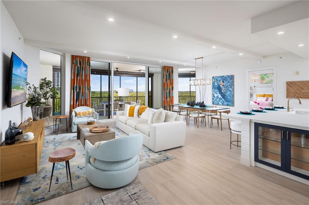 Come home to this Castella "Home in the Sky" and enjoy unparalleled water views and sunsets of Estero Bay and the Gulf of Mexico at The Colony Golf & Bay Club!!! Step into this welcoming, totally reimagined, and fully renovated home filled with natural light and spacious luxury living. This newly renovated Castella Home in the Sky was designed by Clive Daniel and renovated by Imperial Homes of Naples. This redesigned kitchen is a chef's dream with an expanded center island featuring new glass front cabinets, new countertops, new custom backsplash, under cabinet lighting, counter height breakfast bar, built-in appliances, and a pantry! The peaceful, spacious master bedroom offers picturesque views of Estero Bay, including spectacular sunsets! The master suite also features a well thought designed custom closet, along with a new luxury master bath newly designed with new tile, custom mirrors, wall treatment, new countertops, a separate shower, dual vanities, and a dedicated makeup vanity area. Additional features of this newly designed Castella home include wood look wide plank tile flooring throughout, custom window treatments, Clive Daniels furnishings, volume ceilings, electric remote hurricane screen shutters, a formal dining area with new lighting, and a spacious family room great for entertaining! Enjoy the natural light and sunsets with floor-to-ceiling sliding glass doors, and lanai access from your master suite and your guest suite! Both guest suites have been updated with wood look wide plank tile flooring and an updated guest bath with new custom tile and dual vanity for your guests! Entertaining is a delight on the oversized, spacious lanai featuring three separate sitting areas, which is perfect for watching the sunsets! Luxury living at Castella offers every element for recreation and relaxation, including a resort-style pool and spa with newly renovated amenities. Castella also features a stunning tropical open-air lobby with a waterfall, offering a true "welcome to paradise" experience. The Colony at Pelican Landing offers state-of-the-art amenities, including a 34-acre private beach park with a private water taxi shuttle, kayak park, pickleball courts, tennis, fitness center, bocce ball courts, and the list goes on and on! Residents also enjoy waterfront dining at The Colony Bay Club, featuring casual dining overlooking Estero Bay on the third floor and formal dining on the second floor—just minutes from your front door! THIS IS THE BEST OPPORTUNITY IN CASTELLA RIGHT NOW!!! DO NOT MISS OUT!!!! SCHEDULE YOUR PRIVATE SHOWING TODAY AND BEGIN LIVING THE SOUTHWEST FLORIDA LIFESTYLE!!! THIS HOME IS MOVE-IN READY WITH ALL DESIGNER FURNISHINGS INCLUDED!!! COME SEE YOUR NEW HOME IN PARADISE TODAY!!