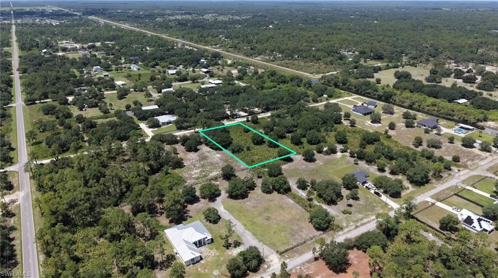 Dry lot, NO flood zone! Wheeler Subdivision. Just 3 lots off the paved road. Another benefit of this lot compared to others in the neighborhood is that it has only a few trees on it. The rest is just brush, which will be much cheaper to clear than cutting down and hauling away a bunch of big trees. Priced to move. Lot of brand new houses nearby, including one on this block.