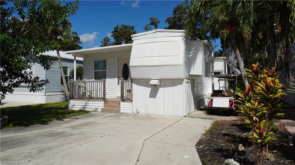 Welcome to Imperial Wilderness, where affordable Southwest Florida living meets an active, resort-inspired lifestyle! Located within this gated 55+ community, this beautifully updated, turnkey residence offers something increasingly difficult to find: **you own the land, with no lot rent**, and enjoy exceptional amenities!

Originally a 1997 Damon fifth wheel, the residence was expanded in 2004 with permanent additions, creating approximately 720 square feet of comfortable living space. This spacious one-bedroom, one-bath home features an inviting living area, well-equipped kitchen, abundant storage and numerous recent improvements.

Inside, you'll appreciate updated luxury vinyl plank flooring, fresh interior finishes, upgraded ceiling fans with dimmable lighting and a kitchen equipped with a propane gas range, full-size refrigerator and dishwasher. Recent improvements include an oversized washer and dryer, tankless gas water heater, ADA-height toilet, updated electrical panel and high-efficiency wall-mounted A/C. The rooftop A/C has also been serviced.

The bedroom offers a comfortable retreat with a premium Reverie adjustable queen-size sleep system, television and generous storage. Offered turnkey, the residence includes furniture, kitchenware, cookware, dishes and everyday essentials. Simply bring your personal belongings!

A newer composite front porch provides a welcoming entrance, while the private rear paver patio offers a setting for morning coffee or entertaining beneath a producing grapefruit tree. Additional features include updated exterior finishes, new skirting, permanent hurricane tie-downs and clamshell hurricane shutters.

Imperial Wilderness residents enjoy a renovated clubhouse, heated pools and spa, fitness center, library, billiards, tennis, pickleball, bocce, pétanque, horseshoes, fishing and a full calendar of social activities. Whether you prefer an active schedule or quiet afternoons in the Florida sunshine, there's something for everyone.

The quarterly association fee of $898 includes water, sewer, trash, lawn maintenance, basic cable and community amenities. With land ownership, no lot rent and so many everyday expenses included, this property offers an appealing opportunity for seasonal or year-round Florida living.

Conveniently situated in Naples, near shopping, dining, golf, boating and Gulf beaches, this turnkey retreat combines affordability, comfort and community.

**Offered at $95,000, furnished and equipped, and being sold AS-IS.** Buyers should verify property specifications, association rules, fees and all information important to their purchase.