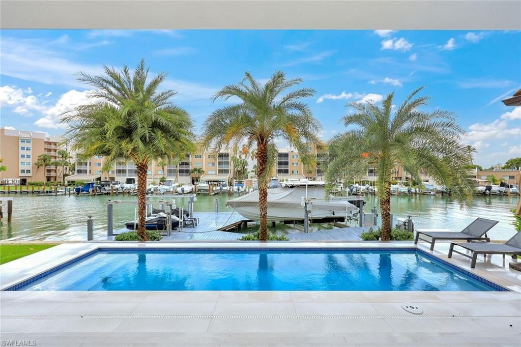 Welcome to the exquisite waterfront residence at 860 Partridge Court on Marco Island, a remarkable property completed in 2022 that perfectly embodies the essence of coastal living. This stunning home encompasses four generously sized bedrooms, each designed with comfort and style in mind, along with four and a half beautifully appointed bathrooms. Spanning an impressive 2,762 square feet of thoughtfully designed living space, this residence seamlessly blends modern aesthetics with functional elegance.

Situated at the South end of Marco Island with Southwest views and on a direct-access canal, this property offers unparalleled opportunities for boating enthusiasts, allowing you to immerse yourself in the vibrant Marco Island lifestyle. Step outside to your private dock, complete with a convenient boat lift and jet ski lift, ideal for launching your watercraft with ease. Experience the freedom of heading out directly ( in a matter of minutes ) to the open waters of the Gulf of Mexico, making weekend excursions a breeze.

The home's modern construction details are evident throughout, from the energy-efficient fixtures to the contemporary finishes that create a harmonious atmosphere. The open-concept design invites natural light to flood the living spaces, highlighting the high ceilings and providing a sense of spaciousness. The gourmet kitchen is a culinary delight, featuring top-of-the-line appliances, ample counter space, and a breakfast bar that is perfect for casual meals or entertaining guests.

With the thoughtful layout, the four bedrooms provide ideal retreats, ensuring everyone has their own sanctuary to enjoy. Each bathroom is tastefully designed, combining style with functionality, and the master suite boasts a luxurious en-suite bathroom and serene views of the water. 

This home is not just a residence; it is an experience. Whether you envision it as your primary home, a seasonal getaway, or a lucrative investment opportunity, 860 Partridge Court captures the spirit of relaxed, waterfront living. 

Discover the perfect blend of contemporary comforts and the vibrant lifestyle that Marco Island has to offer at this extraordinary property. Experience the best of island life and create unforgettable memories in this stunning waterfront home.