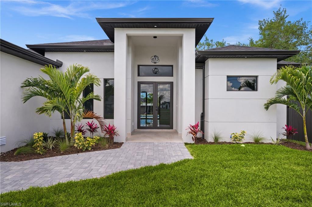Stunning New construction home in one of Cape Coral's fastest - growing areas!!!This beautifully crafted residences features a custom-designed kitchen, premium finishes , and high- quality details throughout. The open concept layout is filled with natural light and seamlessly  connects the  living , dinning and kitchen areas. Every space has been thoughtfully  designed with style, comfort and functionality  in mind. Enjoy your own private outdoor space with a beautiful pool , ideal for relaxing or hosting guests. Located in a quiet residential neighborhood with easy access to main roads , shopping , dinning , and schools , this home offers the perfect combination of elegance convenience , and investment potential. A true move in ready opportunity with exceptional design and quality.