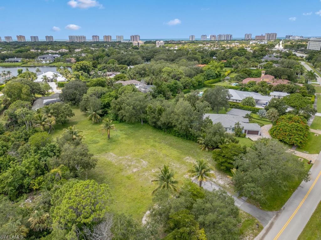 Discover this exceptionally rare opportunity to build your dream home on 1.22 acres located on one of the most desirable streets in the coveted North end of Pine Ridge Estates. With preferred southern exposure, the premium dry parcel offers privacy and convenience in an unbeatable location, presenting the perfect canvas on which to create your custom estate. Situated just around the corner from Mercato and only minutes from Waterside Shops and Vanderbilt Beach, you’ll enjoy direct access to Naples’ most premier luxury lifestyle destinations. Preliminary design plans crafted by Stoft Cooney Architects are also available. Don’t miss this rare chance to build your private enclave in a prestigious location with proximity to everything Naples has to offer!