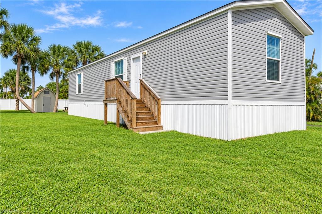 Experience the Charm of Bokeelia in this Never Lived-In 2024 Manufactured Home and Live the Island Life in Affordable Style!  This 2 Bed, 2 Bath Home is Ready for You to Make it Your Own. The Home is Furnished!  Enjoy the Peace of Mind of Never-Used Kitchen Appliances and Washer/Dryer, along with Newer AC and Water Heater and Even New Queen Mattresses. A Sturdy, Custom-Built Shed Provides Valuable Additional Storage for all your Island Essentials. Being Installed AFTER Ian, Milton and Helene and the home sits Higher.  Close to Fantastic Restaurants and World-Class Fishing.  You also have access to Phillips Park with A Community Pool, Pickle Ball Courts and Boat Launches.  Whether You're Looking for a Full-Time Residence or a Seasonal Escape, This Home is Ready for You to Start Living the Island Life!