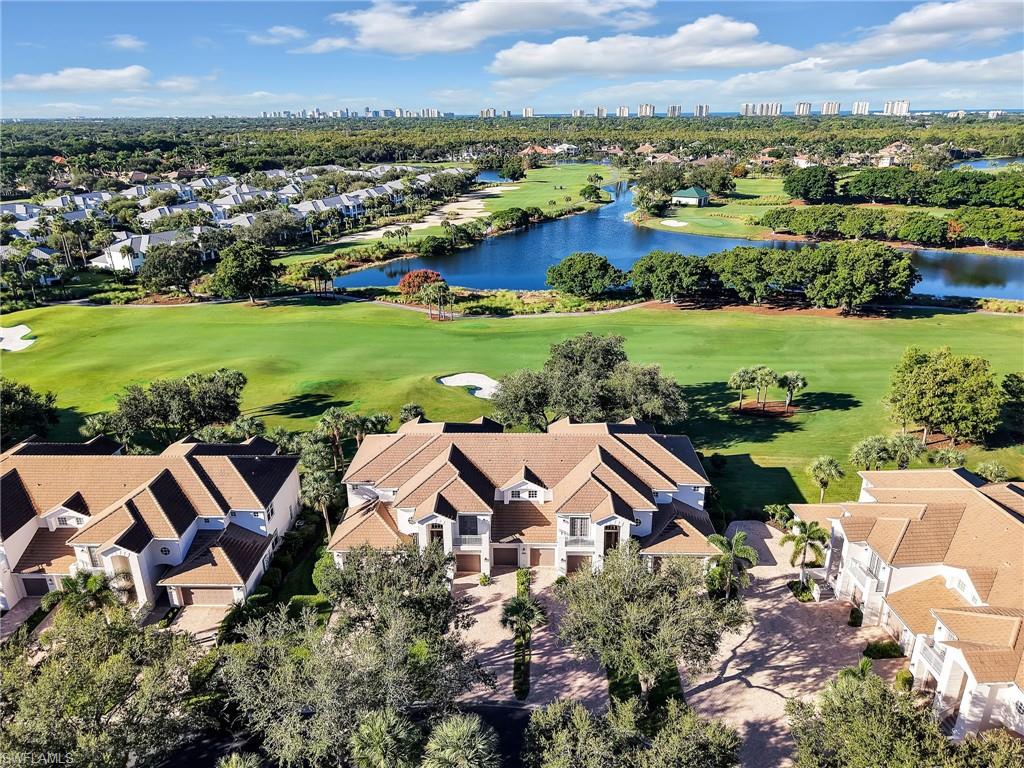 This stunning 2nd-story Mont Claire coach home offers an unparalleled living experience, boasting 2603 sq ft of meticulously designed space with breathtaking, unobstructed South Western  views of the golf course and a long lake—a truly unique feature within the community. Soaring ceilings and an open floor plan seamlessly connect a formal dining room and a lovely great room, all overlooking the spectacular scenery.

The home features elegant tile flooring laid on the diagonal, plush carpeting with 8lb padding, upgraded lighting, plantation shutters, and crown molding. The eat-in kitchen is generously sized with an oversized pantry and newer appliances, offering endless possibilities for culinary creativity.

The expansive primary bedroom is complemented by a private, equally spacious primary bathroom. Two additional bedrooms, each with a private bath, ensure ultimate privacy and comfort for guests or family. A dedicated den provides an ideal space for a home office or an additional entertainment area. The double lanai extends the living space outdoors, perfect for hosting gatherings. Convenience is further enhanced by an oversized two-car garage with a private elevator directly to the main floor. This home has been well cared for with the roof replacement and new exterior paint being completed in 2021.

Residents of Mont Claire enjoy a community pool, spa, exercise room, and community room. The master community of Pelican Marsh elevates the lifestyle with an active tennis, pickleball, and bocce center, a state-of-the-art fitness center, full-service spa facilities, a restaurant and miles of picturesque bike and walking trails amidst lush mature landscaping.

Nestled mere minutes from Pelican Marsh, a vibrant tapestry of cultural attractions, pristine natural beauty and sophisticated urban amenities awaits. Immerse yourself in the performing arts at Artis—Naples the Southwest Florida's premier destination for world-class music, theater and visual arts.

Indulge in the unparalleled allure of Southwest Florida's top-rated sugar-sand beaches where sun-kissed shores meet the gentle lapping of the Gulf of Mexico. Spend your days basking in the warm sunshine, swimming in the crystal-clear waters or searching for unique seashells.

For those seeking an elevated retail and culinary experience, there is an array of world-class shopping and dining destinations. Explore the chic boutiques and diverse eateries of Mercato or discover luxury brands and exquisite cuisine at The Waterside Shops. The charming streets of Old Naples offer a delightful mix of unique shops, art galleries and acclaimed restaurants that are perfect for an evening stroll.

Everyday conveniences are also at your fingertips with gourmet grocery options like Whole Foods and the innovative Seed to Table offering a curated selection of fresh, high-quality produce and specialty items. This prime location truly offers a lifestyle of convenience, luxury, and endless entertainment.