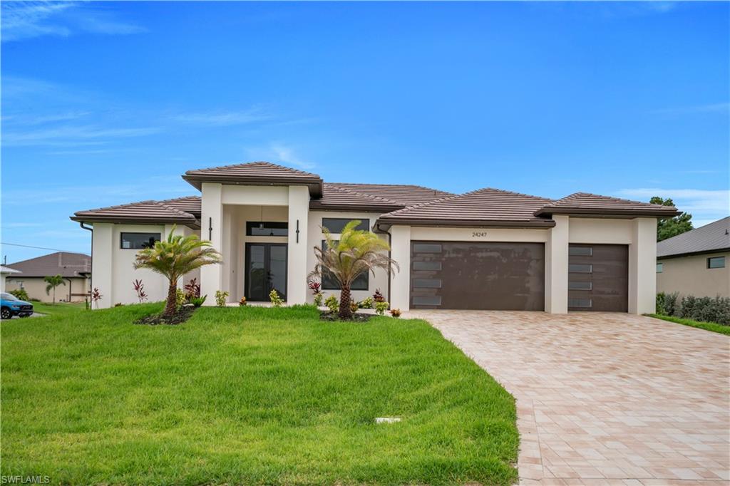 Situated in the highly desirable, deed-restricted community of Burnt Store Lakes, this stunning new construction residence offers the perfect blend of modern luxury, comfort, and functionality. This move-in-ready home features 3 bedrooms plus a dedicated office/flex room, 3 bathrooms with approximately 2,270 square feet of living space designed for today’s lifestyle. Built with quality and durability in mind, the home showcases impact-resistant windows and sliding glass doors, a tile roof, and a spacious 3-car garage with epoxy flooring. The bright, open-concept floor plan is enhanced by custom tile flooring throughout, soaring ceilings, and designer custom lighting fixtures. The gourmet kitchen is the centerpiece of the home, featuring sleek modern appliances, a large center island, a walk-in pantry, a built-in wine cooler, and elegant ambient lighting that creates a warm and inviting atmosphere for entertaining. The luxurious primary suite offers a spa-inspired retreat with dual vanities, a spacious walk-in shower, and a freestanding soaking tub. All bedrooms include custom walk-in closets, while the dedicated office/flex room provides versatility for remote work, hobbies, or additional guest accommodations. A well-appointed laundry room includes a washer and dryer for added convenience. Outdoor living is equally impressive with an expansive screened lanai overlooking a swimming pool featuring a sunbathing area, perfect for relaxing and enjoying Florida’s year-round sunshine. The professionally landscaped exterior includes an irrigation system and enhanced outdoor lighting, providing exceptional curb appeal and low-maintenance living. This thoughtfully designed home combines luxury finishes, modern amenities, and quality craftsmanship in one of Punta Gorda’s most sought-after communities. Conveniently located near Burnt Store Marina, golf courses, dining, shopping, boating, and Southwest Florida’s beautiful Gulf Coast attractions.