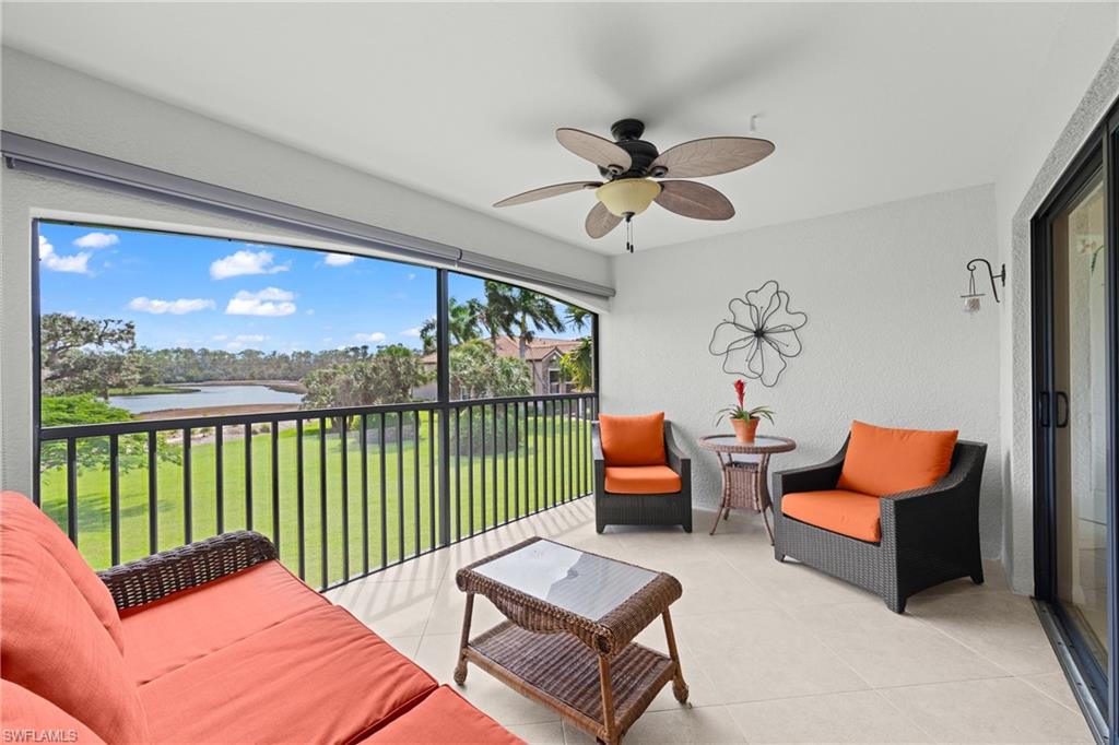 TOP-FLOOR END-UNIT ARABELLA WITH TRANSFERABLE TPC GOLF MEMBERSHIP AND FRONT-ROW VIEWS OF THE 11TH HOLE — THE RAREST RENTAL COMBINATION IN TREVISO BAY! Venezia is the only veranda neighborhood in Treviso Bay with golf course views, only three of its buildings carry a deeded TPC golf membership, and each of those has just two top-floor end units. Number 726 is one of them. From the rear screened lanai you look east over the water to the tee and fairway of the 11th hole on the Arthur Hills/Hal Sutton–designed TPC Treviso Bay course, with the sun coming up over the hole every morning. Inside, the Arabella is the largest of the veranda floor plans at 1,661 sq ft: vaulted ceilings, an open great room washed in end-unit light, 2 bedrooms plus a den with a sleeper sofa (sleeps 6), 2 full baths, a private primary suite at the rear with the same golf views, a second screened lanai at the front, in-unit laundry, and a detached one-car garage. Offered updated and turnkey furnished. The golf membership transfers to guests, so you play TPC Treviso Bay in season, not just the summer months, and you have full run of the resort amenities: the Villa Rilassare amenity center with lagoon-style pool, hot tub, poolside bar and grill, lap pool, full-service spa and salon, attended fitness center with daily classes, Har-Tru tennis, pickleball, bocce, and basketball, all behind a 24-hour manned gate bordering the Rookery Bay reserve. The Venezia pool is across the street, the clubhouse is a short walk, and the back gate puts you minutes from downtown Naples, Gulf beaches, and Marco Island.