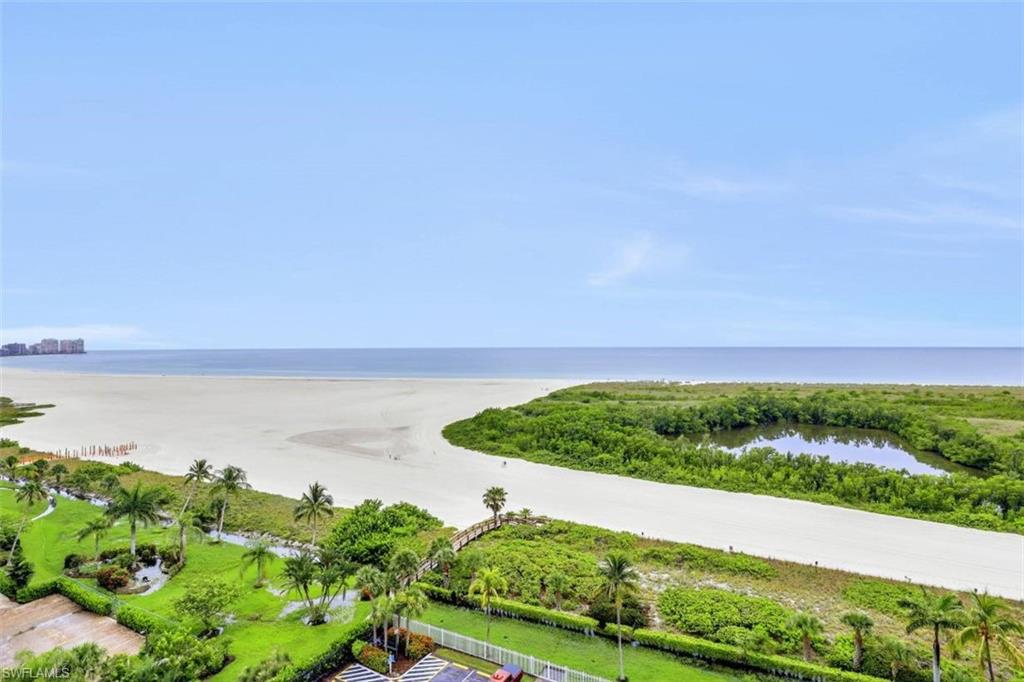 Experience the ultimate coastal lifestyle in this highly coveted 4th-floor, 2-bedroom, 2-bathroom front unit at South Seas Tower 3. Spanning nearly 1,100 square feet, this rare southwest corner unit features a sprawling wraparound balcony that offers breathtaking, uninterrupted front-row views of the Gulf of Mexico, Sand Dollar Island, and lush manicured gardens. Floor-to-ceiling sliding glass doors flood the open living area and fully equipped kitchen with natural light, creating a bright and welcoming beach retreat. Located in one of Marco Island's premier gated communities, residents enjoy 24/7 security, a heated oceanfront pool, chickee huts, tennis courts, pickleball, bocce ball, shuffleboard, a putting green, a fitness center, community room, outdoor grills, direct beach, Gulf access, a fishing pier, kayak storage, and rentable boat slips. Conveniently within walking distance to top island dining spots, this property is also situated in one of the rare beachfront communities that permits weekly rentals, delivering maximum income potential alongside an unbeatable island getaway.
