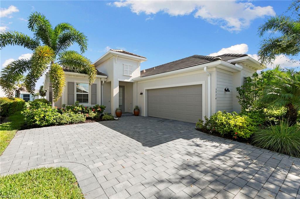 GOLF MEMBERSHIP INCLUDED—and all of this is available for under $650,000! Experience the Southwest Florida lifestyle in this beautifully upgraded, open-concept golf home overlooking the 10th fairway at The National Golf & Country Club at Ave Maria.

From the moment you enter, you will notice the thoughtful details that make this home stand apart. Custom paint, designer lighting and upgraded fixtures add warmth and personality throughout, while the open layout creates an easy flow between the main living, dining and kitchen areas. It is a comfortable, inviting space designed for both everyday living and entertaining family and friends. The spacious den features custom built-in bookshelves and offers the flexibility to serve as a home office, library, television room or additional guest space.

The indoor living areas open to an expansive screened lanai created for year-round Florida enjoyment. A custom wood ceiling gives the outdoor space a distinctive, finished look, while the outdoor kitchen makes grilling and entertaining effortless. Spend sunny afternoons beside the heated pool, unwind in the connected spa or simply relax with a morning cup of coffee while taking in the peaceful views across the 10th fairway. With generous space for dining, lounging and gathering, this outdoor area truly functions as an extension of the home.

Ownership provides access to an exceptional array of amenities within The National Golf & Country Club. Enjoy the gorgeous new clubhouse, two on-site restaurants, a full-service spa, resort-style pool, three additional satellite pools, pickleball, tennis and bocce ball. Whether your ideal day includes a round of golf, lunch with friends, time at the spa or an afternoon by the pool, everything you need to enjoy the country club lifestyle is right within the community.

Beyond the gates, Ave Maria offers a welcoming hometown atmosphere centered around its charming town center and Ave Maria University. The surrounding area provides countless opportunities to enjoy the natural beauty of Southwest Florida, including the nearby Everglades, bird-watching, hiking and outdoor exploration. Spend your days golfing beneath the palms, observing native wildlife, enjoying scenic trails or heading out to experience the dining, shopping and beaches of the greater Naples area.

This is more than a home—it is an opportunity to enjoy the relaxed, active and social lifestyle that makes Southwest Florida so desirable. A golf home with a private pool and spa, fairway views, an outdoor kitchen, beautiful custom finishes and resort-style amenities for under $655,000 is an opportunity you do not want to miss!