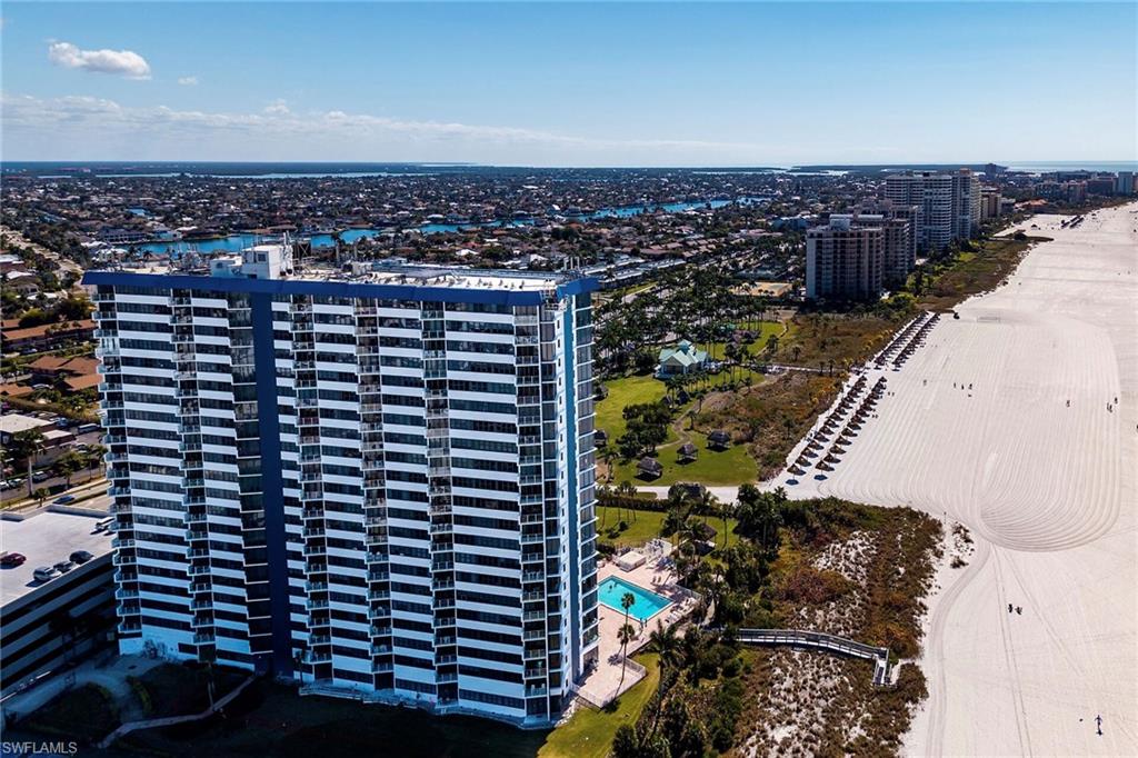 Beautifully remodeled and move-in ready, this Gulfview condo combines stylish coastal finishes with scenic beach views and spectacular year-round sunsets. The residence features a bright, elegant, open kitchen with white cabinetry, stainless steel appliances, recessed and under-cabinet lighting, and a stylish subway-tile backsplash. An oversized quartz peninsula with seating for four provides ample workspace and a natural gathering place for casual dining and entertaining. Both bathrooms showcase contemporary vanities, modern fixtures, and stylish tile. Luxury flooring, recessed lighting, and coastal decor complete the refined interior. Additional features include impact-resistant windows and sliders, upgraded glass balcony railings, new A/C (2025), new water heater (2025), and convenient first-floor garage parking. Gulfview has undergone extensive building renovations and offers an impressive collection of resort-style amenities, including direct beach access, a heated and newly resurfaced tiled pool, fitness room, tennis and pickleball courts, tiki hut with grilling area, social room, beach and bike storage, secure garage parking, lobby security, and more.Ideally located adjacent to Residents' Beach and convenient to shopping and dining, this turnkey condo is ready to enjoy as a full-time residence, seasonal retreat, or investment property. Experience the Marco Island lifestyle with the beach, sunsets, and Gulf breezes right outside your door.