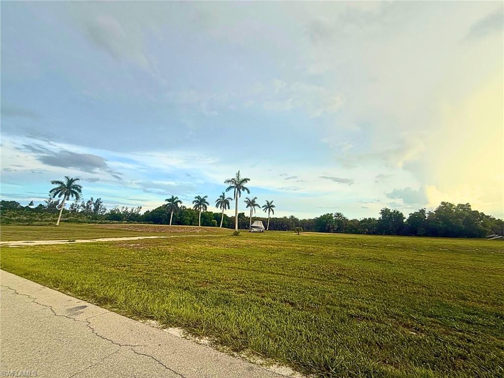 Imagine building your custom dream home on this exceptional 1.2-acre cleared homesite in the peaceful island community of Bokeelia. Perfectly positioned just a half mile from Lavenders Landing Boat Ramp, you'll enjoy quick access to some of Southwest Florida's finest fishing—especially world-renowned tarpon fishing—as well as the pristine waters of the Gulf of Mexico.

This AG-2 zoned property offers the flexibility to build not only your dream home but also a barn or additional storage for your RV, boat, trailers, and recreational vehicles. The sellers have already completed significant site improvements, including a raised building pad that could save you thousands in fill and site preparation costs. A picturesque pond has also been created, complemented by a growing collection of Royal Palms that provide the perfect backdrop for your future backyard oasis.

Pine Island is renowned for its laid-back Old Florida charm, tropical beauty, and unmatched outdoor lifestyle. Spend your days boating, fishing, kayaking, or exploring nearby islands, then return home to breathtaking sunsets, gentle tropical breezes, and spectacular night skies. Surrounded by lush tropical vegetation—including mango, banana, coconut, and other fruit trees—you'll experience the tranquility that makes island living so special. Keep an eye out for bald eagles soaring overhead, ospreys hunting along the shoreline, and playful dolphins and gentle manatees that frequently grace the surrounding waters.

Whether you're looking for a private island retreat, a waterfront lifestyle, or the perfect place to build your forever home, this remarkable property offers endless possibilities in one of Southwest Florida's most desirable island communities.