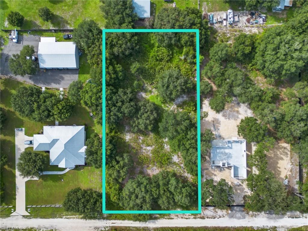 Bring your vision to life on this beautiful 1.25-acre parcel in Labelle! Located just off paved Wheeler Road on 22nd Place, this spacious property offers the privacy and freedom of acreage while still providing convenient access to a paved main road. The property is partially cleared, giving you a head start on creating your future homesite, while the surrounding area continues to grow with newer homes being built nearby. With no HOA, you'll have more flexibility to make the property your own. The parcel is approximately 1.25 acres (54,450 sq. ft.), providing plenty of room for a home, outdoor living, workshop, toys, gardening, or simply enjoying the extra space that comes with owning acreage. The property is also bordered in portions by existing fencing from neighboring properties, adding to the sense of separation and privacy. Whether you're ready to build your Florida home, looking for room to spread out, or searching for land in an area experiencing new growth, this is an opportunity to create something of your own.