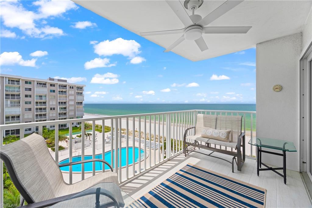 BEACHFRONT SOUTHWEST GULF VIEWS AT THE NAPLES CONTINENTAL CLUB — SUNSETS EVERY NIGHT, SAND JUST AN ELEVATOR RIDE AWAY! Perched on the fifth floor — above the treeline with long, angled views down the beach and out over the Gulf of Mexico — this updated, turnkey-furnished 2-bedroom, 2-bath residence claims the coveted southwest exposure at one of the Moorings' true beachfront addresses. Watch the coastline curve away from your private balcony, then step downstairs and onto the sand. Inside, the open living and dining areas are bright and move-in ready, the kitchen is well equipped for full-time living, and the bedrooms sleep four comfortably with a king in the primary suite and a queen in the guest room. The Naples Continental Club completed a top-to-bottom amenity renovation in 2024: resort-style beachfront pool, reimagined courtyard, modern fitness center, stylish lobby, club room, library, shuffleboard, BBQ grills, and guest suites — all overlooking the Gulf. Walk to the waterfront dining and boutiques of Venetian Village; minutes to Waterside Shops and Fifth Avenue South. Laundry facilities in the building.