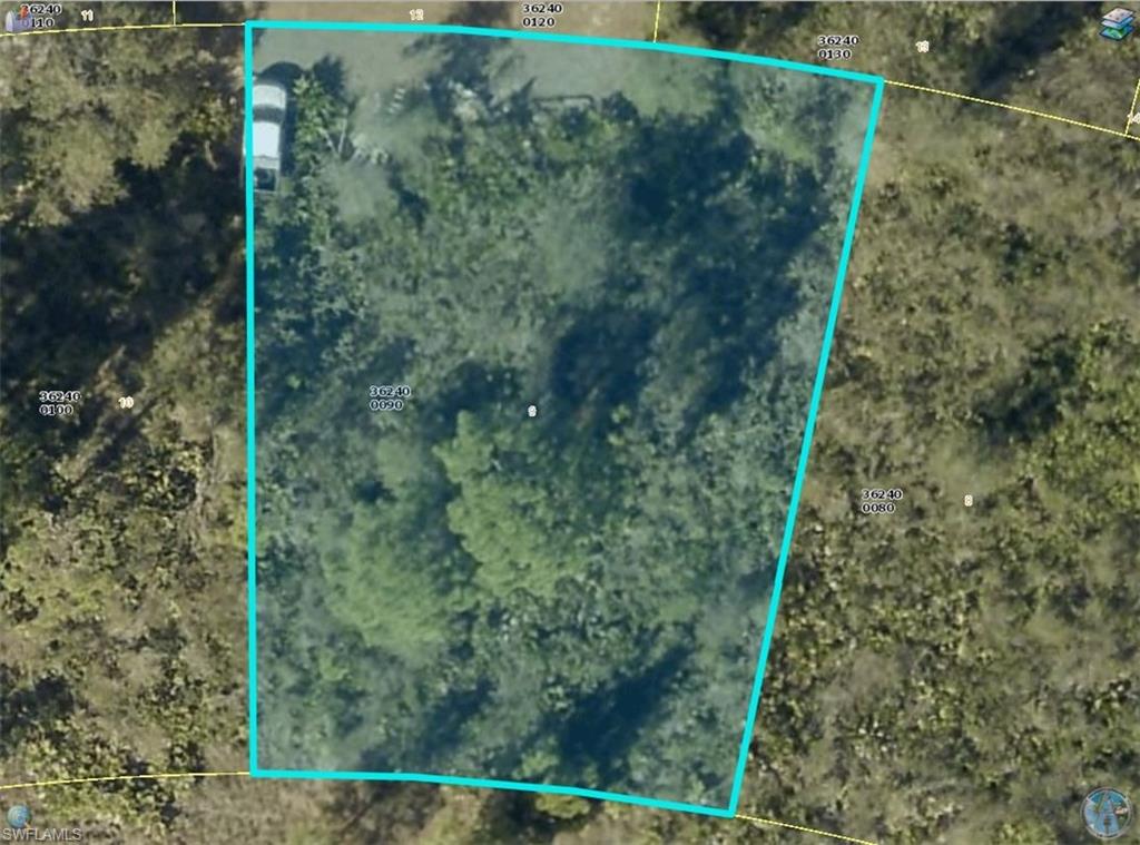 Approximately 0.27-acre vacant residential lot in the Greenbriar area of Lehigh Acres. Located on La Roda Avenue, this parcel offers a wooded setting and paved road frontage. Lee County Property Appraiser records show RS-1 zoning.