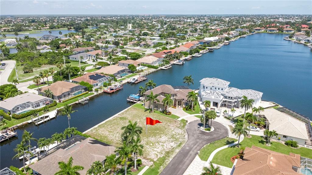 One of the few Gulf Access lots left on Marco Island. Positioned on an oversized, .28 acre, cul-de-sac homesite with 120 feet of waterfrontage (concrete seawall in place), 375 Wales Court offers the perfect canvas for an exceptional custom residence. Framed by sparkling waterways and surrounded by luxury homes, this premier lot captures the essence of the Marco Island lifestyle, boating, sunshine, and breathtaking water views. Wake up and smell the salty air while enjoying your sunrise coffee overlooking the water to sunset cruises from your backyard dock, the refreshing Gulf will fill your days. With Gulf access and wide canal views, every day begins and ends on the water. Located just minutes from Marco Island's renowned beaches, fine dining, boutique shopping, golf courses, and marinas, this is more than a homesite, it's an opportunity to build a legacy waterfront residence in one of Southwest Florida's most prestigious island communities.