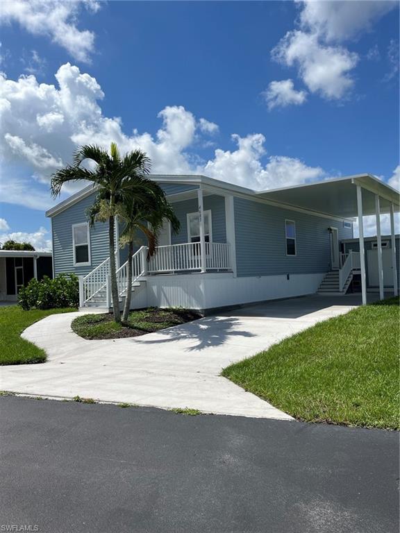 New construction!! Palm Harbor Home located in sought after 55+ community - Spring Creek Village, Bonita Springs close to shopping, restaurants, medical, airport, beaches, gulf and all that SW Florida has to offer. This new construction manufactured home has two bedrooms, walk in closet, den, dining room, kitchen with breakfast bar and all stainless appliances, utility room with access to the carport and storage shed, living room is open to the kitchen. High ceilings throughout interior. Front porch to enjoy the day. This community boasts clubhouse with year-round activities and events, pool, hot tub, pickle ball, boccie ball, shuffleboard, boat storage, boat ramp and direct access to the Gulf, freshwater lake with fishing pier, free community kayaks for residents and guests, BBQ, and basketball. The lots are owned and extremely low HOA fees! Near Coconut Point Mall.