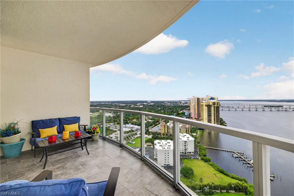 Experience elevated waterfront living at Oasis Tower One in downtown Fort Myers! Perfectly situated on the 28th floor, this impressive 3-bedroom plus den, 2.5-bathroom condo offers captivating water views of the Caloosahatchee River and Downtown from every room. The remodeled kitchen blends style and functionality with quartz countertops featuring a striking waterfall edge, an induction range, wine refrigerator, and convenient undermount electrical outlets. Tile flooring throughout and plantation shutters add a polished touch, while a whole-house water filtration system provides an extra level of comfort. Step onto the spacious balcony to enjoy breathtaking views of the river, spectacular Florida sunsets, and front-row seats to fireworks displays. With water views as your backdrop, this is the perfect place to enjoy your morning coffee, entertain friends, or unwind at the end of the day. Major mechanical updates include a new air conditioning system in 2024 and a new hot water heater in 2025. Oasis offers an impressive array of amenities to complement the Florida lifestyle, including a riverside pool deck with cabanas and lounge seating, a fitness center with water views, sauna, spa, tennis, a social lounge, billiards room, library, and barbecue area. Enjoy the convenience of high-rise living while walking to the restaurants, entertainment, and attractions of downtown Fort Myers. With its spectacular river views, stylish kitchen upgrades, spacious balcony, and resort-style amenities, this 28th-floor residence offers a wonderful opportunity to enjoy the best of Southwest Florida waterfront living.