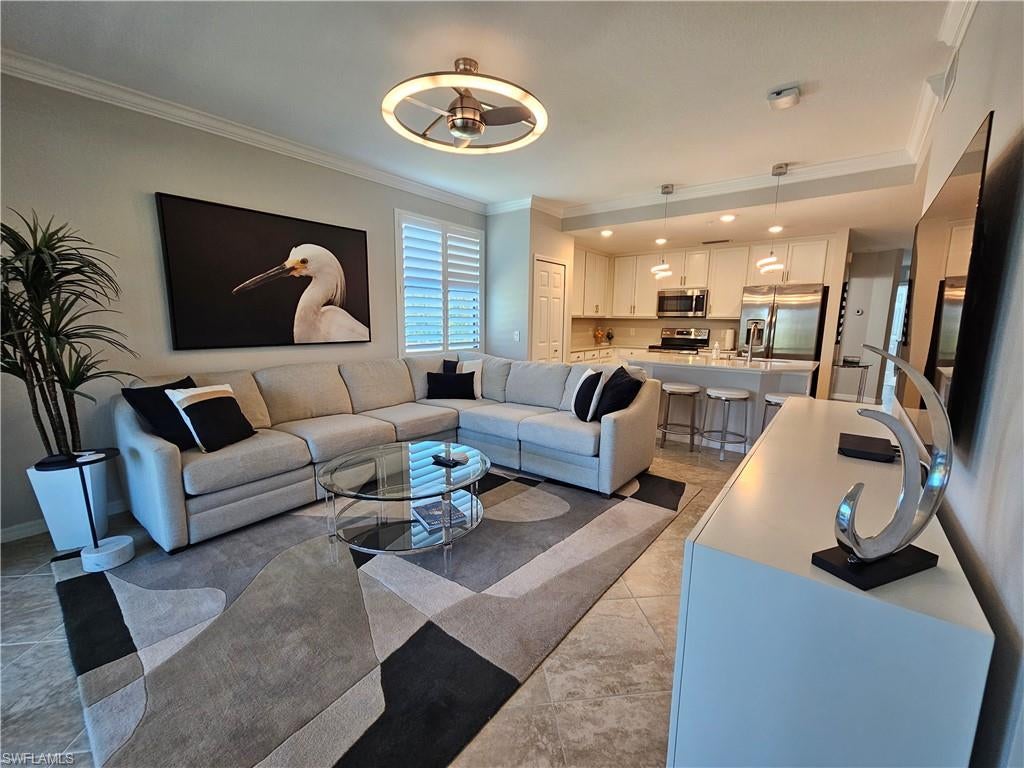 Available October and November 2026 (minimum 30 days).  No longer available December 2026 through April 2027. ELEGANT TURNKEY END UNIT offering two bedrooms plus den (with sleeper sofa), two full baths and private lanai located in the coveted resort-style, gated community of TREVISO BAY. This light and bright home with modern layout, lighting and furnishings affords more privacy as it is the final building at Trevi with no neighboring building views off the lanai. The amenities package at Treviso includes access to dining at the Clubhouse and casual dining at the lagoon-styled pool, satellite pool with outdoor grill, fitness center & studio, spa, pickleball, tennis and bocce.  Treviso Bay is conveniently located with close proximity to 5th Avenue South, Third Street South, fine & casual dining, shopping, the beautiful Gulf beaches, entertainment and more.