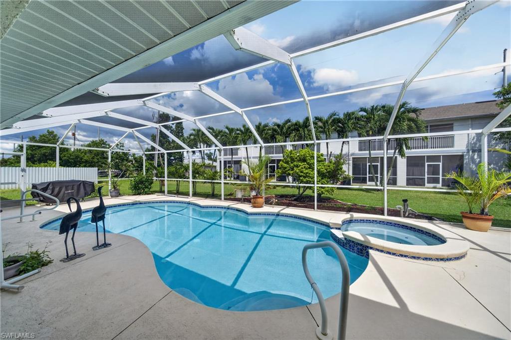 OVERSIZED LUXURY DUPLEX | POOL | 3 BEDROOMS PER SIDE | 2-CAR GARAGE EACH SIDE | NOT IN A FLOOD ZONE

A truly unique opportunity in Cape Coral! This oversized, exceptionally well-maintained duplex has been owned by the original owner since new and lovingly maintained, making it an outstanding option for an investor, multi-generational family, or owner-occupant looking to generate rental income.

Each spacious residence offers approximately 1,800 sq. ft. of living area with 3 bedrooms, 2 bathrooms, and its own 2-car garage. Cathedral ceilings and oversized porcelain tile create a bright, open feel, while a bonus room off the kitchen provides additional flexible living space. Each side includes a full complement of appliances plus a separate utility room with washer, dryer, and utility sink.

The possibilities are exceptional: live in one side and rent the other, create a two-family or extended-family setup, or explore its potential as a vacation rental investment. Both residences are currently occupied by long-term tenants.

Major improvements include a new roof in 2024 with 25-year shingles, exterior and interior painting, lush front and rear landscaping with irrigation, and 52-gallon water heaters.

The outdoor living area sets this duplex apart. Enjoy a SCREENED-IN POOL and spacious lounging area, with the pool recently refinished and tiled and is serviced by a separate electric meter.

Each side has its own private garage and living space while sharing an impressive resort-style outdoor setting. Both units currently rent for approximately $2,300 per month, offering immediate income potential.

Located on an oversized three-lot site and not in a designated flood zone, this is a rare combination of space, condition, flexibility, and income potential.

Whether you’re looking for an investment, multi-generational living, or the opportunity to live on one side while your tenant helps offset your expenses, this property deserves a closer look. Schedule your private showing today!