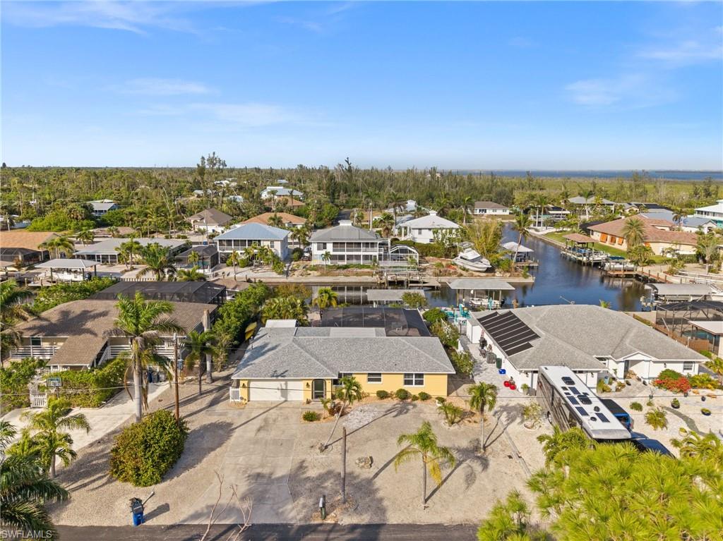IT'S 5:00 SOMEWHERE!!! This tastefully remodeled 3 bed, 2 bath pool home is the perfect vacation/full time home for those looking to enjoy all that the Florida lifestyle has to offer from boating, kayaking and some of the best fishing in SW Florida. For the boating enthusiasts, enjoy a boat ride to the beaches of Fort Myers, Sanibel or Cayo Costa from the Direct Gulf Access Canal right in your back yard with composite dock, boat lift and jet ski lift!! Wait, there's more....THE PROPERTY ALSO HAS DEEDED LAND ACROSS THE STREET FOR ADDITIONAL PARKING OF AN RV, BOAT, OR GUESTS! INVESTORS TAKE NOTE: THIS PROPERTY HAS BEEEN A SUCCESSFUL VACATION RENTALFOR THE PAST 5 YEARS, AND CONTINUES TO BE IN DEMAND AND PRODUCE INCOME.