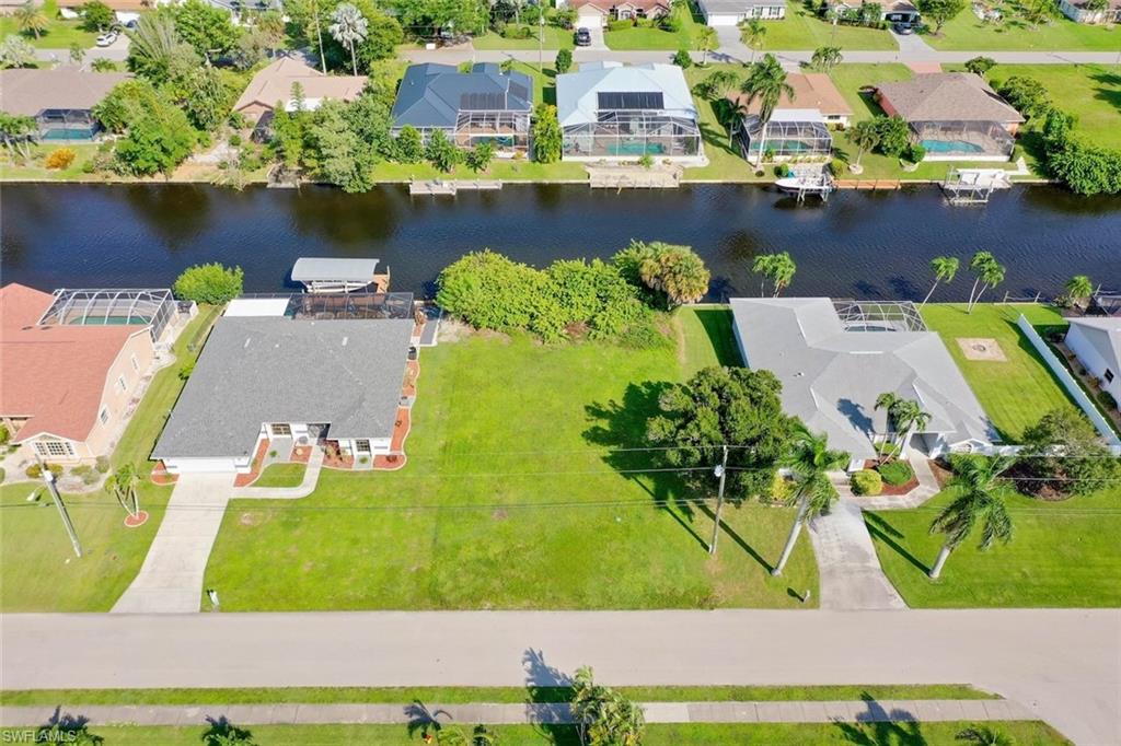 BUILD YOUR DREAM WATERFRONT HOME IN SOUTHWEST CAPE CORAL! Discover the possibilities with this Gulf-access residential lot located in an established neighborhood surrounded by beautiful waterfront homes. This property presents an opportunity to create your own piece of Southwest Florida paradise. Imagine designing a custom home with a waterfront lanai, outdoor entertaining space, and the boating lifestyle you've always envisioned. Enjoy scenic canal views and access to Southwest Florida's waterways, where boating, fishing, and waterfront adventures are part of everyday life. Conveniently located near shopping, dining, entertainment, and everything Cape Coral has to offer. Whether you're ready to build or looking to invest in waterfront property, this Gulf-access homesite offers an opportunity to bring your vision to life. START PLANNING YOUR SOUTHWEST FLORIDA WATERFRONT LIFESTYLE TODAY!