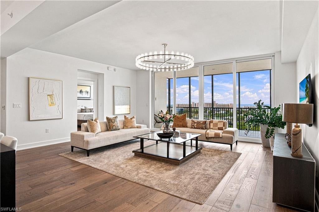 PANORAMIC GULF & BAY VIEWS define this exceptional 7th-floor residence at Grandview at Bay Beach. Offering 2,414 square feet of beautifully designed living space this 3-bedroom, 3-bath residence captures spectacular Gulf sunsets and serene Bay sunrises from nearly every room. Floor-to-ceiling impact sliders extend the living area onto an expansive screened lanai, creating a seamless indoor-outdoor coastal lifestyle considered to be one of the more desirable floor plans. Thoughtfully upgraded throughout, the residence features custom white oak flooring, designer lighting, furnishings from Restoration Hardware and a sophisticated chef's kitchen with newly upgraded quartz countertops and backsplash accented by crisp white cabinetry, a large, waterfall quartz island and premium Bosch appliances. The spacious primary suite enjoys captivating water views and a spa-inspired bath with dual vanities, frameless glass shower, multiple shower heads and bench seating. Both guest suites offer ensuite baths and water views, including one with its own private open-air balcony. Completed in 2023 and home to only 58 residences, Grandview offers a rare combination of newer construction, a private elevator and resort-style living on the desirable south end of Estero Island. Amenities include a resort pool and spa, fitness center, yoga room, community room, guest suites, BBQ terrace with fire pits, tennis courts, pickleball, walking paths and a putting green. Deeded beach access is located directly across Estero Boulevard, with nearby marinas providing convenient access to the Gulf and slips available for purchase or lease for Waterside residents. A beautifully finished, move-in-ready waterfront residence offering the best of Gulf and Bay living.