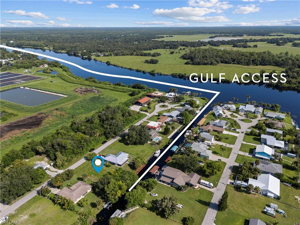 GULF ACCESS — BUILD YOUR WATERFRONT HOME IN RIVER OAKS. This vacant lot sits on a quiet cul-de-sac street in a small, well-maintained Alva community where newer homes continue to go up. Approximately 80 feet of water frontage by 128 feet deep per the Lee County measuring tool, with almost immediate access to the Caloosahatchee River and Gulf access beyond. The lot sits between the Franklin and Ortona locks, a stretch of river known for its controlled water levels. From your future dock, the water goes both directions. Head west toward downtown Fort Myers, roughly 17 miles, and on to Fort Myers Beach and the Gulf at about 30 miles. The Boathouse Tiki Bar & Grill is around 10 miles by boat or car. Head east and the Okeechobee Waterway carries you to Lake Okeechobee, some 43 miles away, and all the way across the state to Stuart and the Atlantic. On land, you're close to everyday conveniences — a Publix shopping center about 7 miles out, and Rooster's Route 80 farm stand, a local favorite for produce, pies, and its monthly vendor market, under 6 miles away. RSW International is roughly 33 miles; Punta Gorda Regional about 26. Waterfront land with true Gulf access is a finite commodity. Bring your builder and your boat. *Buyer/Buyer's Agent to verify all dimensions, distances, utilities, and permitted uses with Lee County.