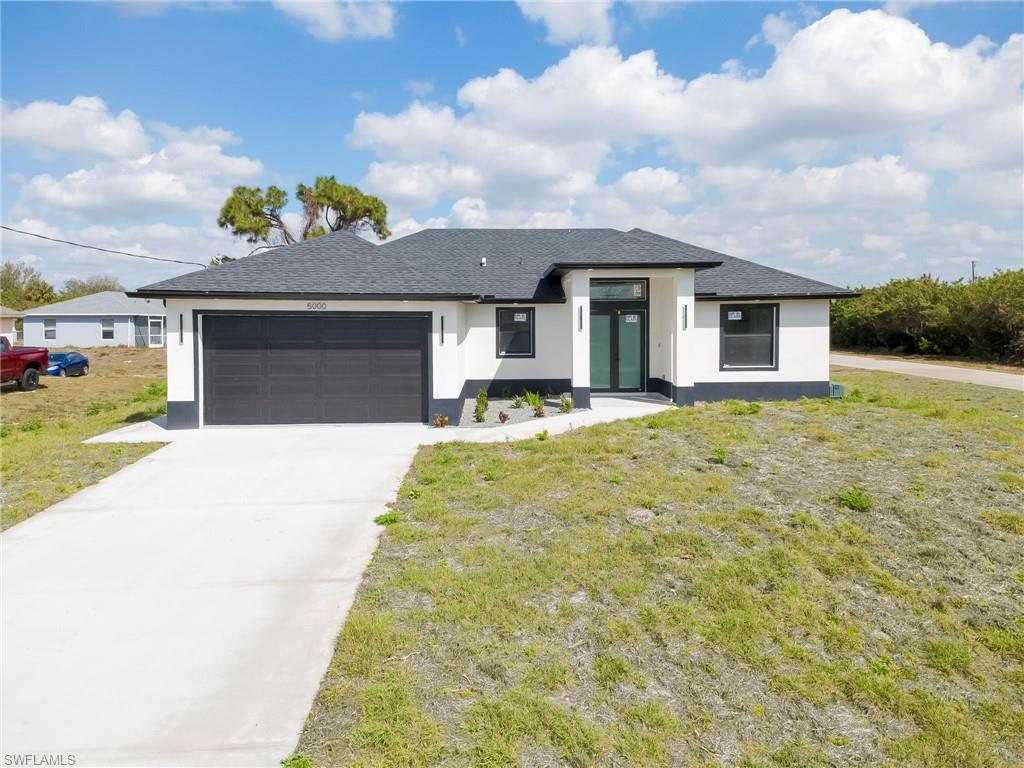 Discover this beautifully designed 3-bedroom, 2-bath home situated on a desirable corner lot in the growing community of Lehigh Acres, offering modern luxury, smart-home technology, and exceptional comfort.
This home features high-end finishes throughout, including hurricane-impact windows and an impact-rated garage door, luxury fixtures, and spa-like bathrooms designed to create a relaxing retreat. The bright, open-concept layout is filled with natural light and showcases a custom feature wall, perfect stylish entertaining.
The chef-inspired kitchen is equipped with Samsung Smart Wi-Fi appliances, including an air-fryer oven, stainless steel finishes, ample cabinetry, and a stunning waterfall island with a coordinating backsplash, creating a beautiful space for everyday living and entertaining.
Smart-home features add convenience, security, and entertainment throughout the property, including a Ring doorbell, smart camera system that will convey with the home, and speaker/amplifier system inside and outside.
Step outside to the spacious under-truss lanai featuring an outdoor kitchen, with plenty of room to create your dream pool and outdoor oasis. The property also features a sidewalk and the added space and appeal of a corner lot. Conveniently located near new shopping, restaurants, schools, and recreational activities, and just a drive away from Florida's beautiful beaches, this home offers the perfect combination of luxury, technology, comfort, and accessibility.
Call today to schedule your private showing and experience everything this exceptional Lehigh Acres home has to offer!