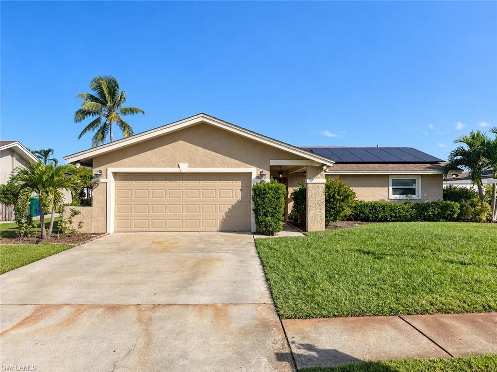 This home offers approximately 1,490 square feet of living space with an inviting floor plan, spacious eat-in kitchen, stainless steel appliances, updated bathrooms, and laminate and tile flooring. Additional features include impact-resistant windows, an impact-resistant front door, a fenced backyard, and a screened lanai overlooking the private heated pool and spa.  Located in an established neighborhood in Fort Myers with sidewalks and **NO mandatory HOA fees**, this property offers convenient access to shopping, restaurants, schools, beaches, and major roadways throughout Fort Myers. **SHORT SALE OPPORTUNITY!** Discover this charming 3-bedroom, 2-bathroom single-family home with a 2-car garage, heated pool, and spa in the desirable Principia neighborhood of Fort Myers!