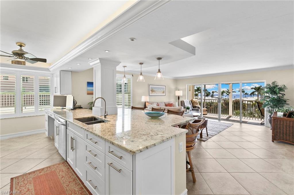 Experience the best of Marco Island’s coastal lifestyle in this beautifully updated, spacious 3-bedroom condominium at Surfwalk, ideally situated near the island’s southern end. Enjoy elevated views of the Gulf and passing boat traffic to the south over Surfside, creating a picturesque backdrop for everyday island living. Thoughtfully designed for comfort and convenience, this residence offers generous living spaces and impressive storm protection. An extra-deep private garage offers a rare combination of secure vehicle parking, a workout area, and abundant storage. The space features a durable epoxy-coated floor, custom cabinetry with a built-in workbench, and extensive wall-mounted storage. A dedicated dehumidifier helps control humidity year-round—a welcome feature during Marco Island’s humid summer months—and helps protect vehicles, fitness equipment, and stored belongings. Just minutes from South Beach access and Caxambas Park boat ramp, this exceptional location places pristine beaches, boating adventures, waterfront dining, and outdoor recreation within easy reach. Enjoy the benefits of being just off the waterfront while still embracing the beauty and convenience of island living. Whether you're seeking a full-time residence or a seasonal retreat, this Surfwalk condominium offers an ideal combination of space, coastal views, modern comfort, and the relaxed lifestyle Marco Island is known for.