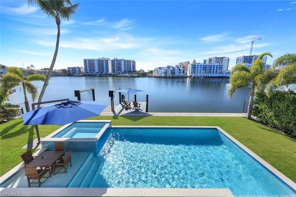 Beautifully furnished home with huge southern views across Vanderbilt Lagoon towards the Ritz Carlton.  Bring your boat or personal watercraft!
