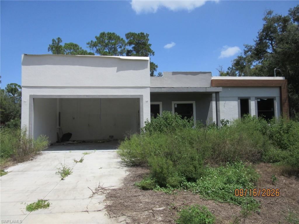 *** INVESTOR ALERT** Outstanding opportunity to own this unfinished new construction home in a desirable Lehigh Acres location! This mostly completed spec home offers the chance for an investor, contractor, or owner-occupant to finish the property to their own tastes and specifications. Situated on a spacious lot, this home has tremendous potential and is ready for the next owner to bring it across the finish line. Whether you're looking for your next investment project or the opportunity to customize your dream home, this property is a must-see. Conveniently located near schools, shopping, dining, and major roadways. Property is being sold AS-IS. Don't miss this unique opportunity!
