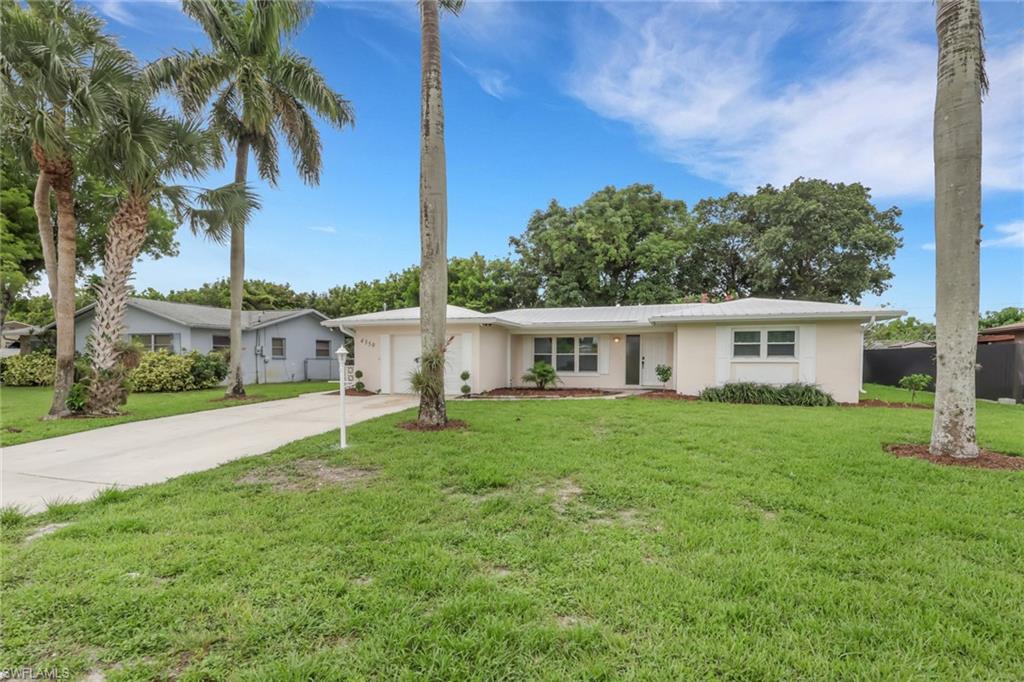 If you've been looking for a home with no HOA, no restrictions, and plenty of updates already done for you, this one is worth a look. Located in the heart of Golden Gate City, this 2-bedroom plus den, 2-bath home offers a comfortable layout and a long list of recent improvements.  The home features a metal roof and A/C system installed in 2020, newer windows and sliding door,  newly installed laminate flooring throughout, fresh interior paint, and new soffits around the entire exterior. The property is connected to city water and sewer, and also includes a private well for irrigation, helping keep the yard looking great while saving on water costs.  Step outside to enjoy the fully fenced backyard, offering plenty of room for pets, family gatherings, gardening, and even a future pool. A sprinkler system makes lawn maintenance easy, and with no HOA, you'll have the freedom to enjoy your property without additional fees or restrictions.  Conveniently located near shopping, restaurants, schools, parks, and just a short drive to Naples' beautiful beaches, this home offers the perfect combination of comfort, convenience, and flexibility.