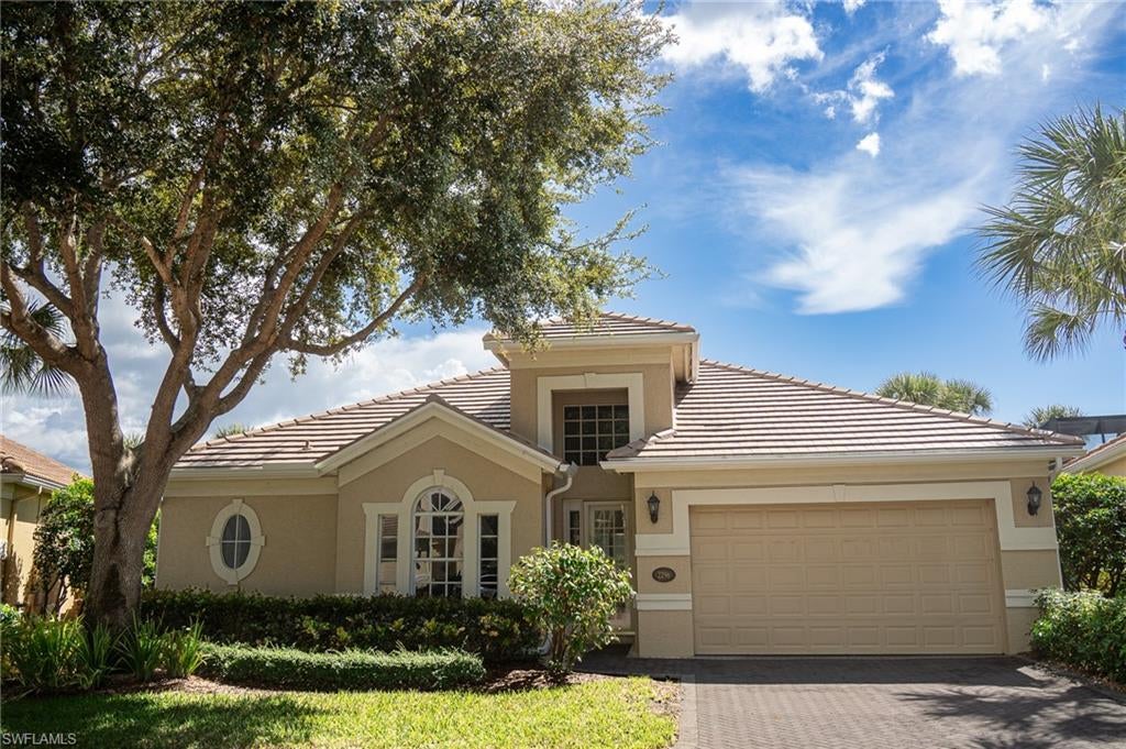 Beautiful long lake views with southern exposure and a new 2026 roof on this single-family home in Island Cove at Pelican Marsh. An open floor plan with tile floors, crown molding, and tray and volume ceilings flows through the sliders to an expanded screened lanai on the community's largest lake, looking southeast and southwest across the water. 2025 Trane heat pump and 2026 water heater. 2 bedrooms + den, 2.5 baths, formal dining room, sunny lakeside breakfast nook, and a 2-car garage.

White kitchen with quartzite counters, plantation shutters, built-in cabinetry, and an owner's suite with a large walk-in closet and jetted tub. LED lighting runs through the kitchen, baths, laundry, and garage. The pie-shaped homesite and squared floor plan give the house wide lake frontage and room to add a private pool, in a quiet interior position set well off Pelican Marsh Boulevard and a short walk to Island Cove's lakeside community pool. Turtles and wading birds gather along the shoreline.

Pelican Marsh residents have an attended fitness center, full-service spa, restaurant, bocce, and a professional tennis program, minutes from Mercato, Waterside Shops, and Vanderbilt Beach. Golf membership is available at Pelican Marsh Golf Club.