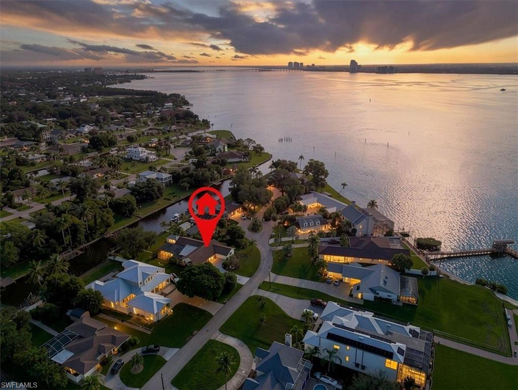 Welcome to Florida coastal living at its finest! This beautifully remodeled 5-bedroom, 2-car garage waterfront home is MOVE-IN READY and designed for enjoying the very best of the Southwest Florida lifestyle. Situated on a DEEP, WIDE CANAL WITH NO BRIDGES, this is a boater’s dream with a 13,000-POUND BOAT LIFT and easy access to the water. The home also features a NEWER ROOF. From the moment you walk through the door, you will love the light, open and inviting living space. The updated kitchen features a large island with seating for up to 9, perfect for gathering with family and friends, while the living area showcases beautiful COFFERED CEILINGS that add character and elegance. The spacious primary suite features an UPDATED PRIMARY BATHROOM AND UPDATED CLOSET, while the additional bedrooms offer WALK-IN CLOSETS for plenty of storage. Step outside and enjoy the Florida lifestyle with a private 7-FOOT-DEEP POOL, beautifully landscaped grounds, HOT-AND-COLD OUTDOOR SHOWER and OUTDOOR KITCHEN WITH DISPOSAL, creating the perfect space for entertaining after a day on the water. Spend your days BOATING, FISHING AND ENJOYING THE WATER, then unwind while watching spectacular SOUTHWEST FLORIDA SUNSETS from your own waterfront paradise. A truly unique bonus is the massive 20 X 12 AIR-CONDITIONED STORAGE BUILDING, offering endless possibilities as a craft room, studio, workshop, gym, hobby space or whatever you envision. This home offers the perfect combination of COASTAL LIVING, ENTERTAINING, BOATING, FISHING AND RELAXATION. Come experience the Florida lifestyle and make this exceptional waterfront home your own! SOME PHOTOS HAVE BEEN VIRTUALLY STAGED.