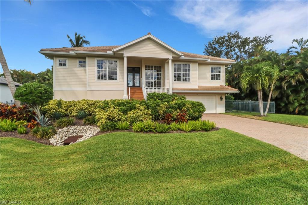 An impeccably maintained home with stunning water views & premium upgrades. Located in Brendan Cove, a gated community featuring a private marina with direct Gulf access. Boat slips are available for lease, making this a dream for water enthusiasts. Enjoy peace of mind with a brand-new roof installed in February 2025 and two new AC units added in 2022. This beautifully appointed 3-bedroom, 3-bathroom residence with a spacious den offers the perfect blend of elegance and functionality.  Step into the open-concept great room, where natural light pours in through expansive windows adorned with custom Hunter Douglas blinds. The seamless layout connects the living area to the chef’s kitchen, cozy dinette, and outdoor deck—all overlooking a serene pond.  Custom millwork and maple hardwood flooring throughout, gourmet kitchen with granite countertops, stainless steel appliances, gas cooktop, reverse osmosis drinking system and a whole-house water filtration for added comfort and health.  Relax on the balcony as you take in breathtaking sunsets and tranquil views of the lake and fountain. Or retreat to your private heated pool and spa, perfect for year-round enjoyment. The lower level features a 4-car tandem garage, generous storage, and over 1,000 square feet of enclosed, finished bonus space with direct access to the pool deck—ideal for a gym, game room, or second office space. Situated on an oversized, fully fenced lot, this home offers privacy and ample space for outdoor activities. Conveniently located just minutes from Bonita Bay Plaza, and a short drive to Coconut Point Mall and Fort Myers Airport, you'll enjoy easy access to shopping, dining, and entertainment.