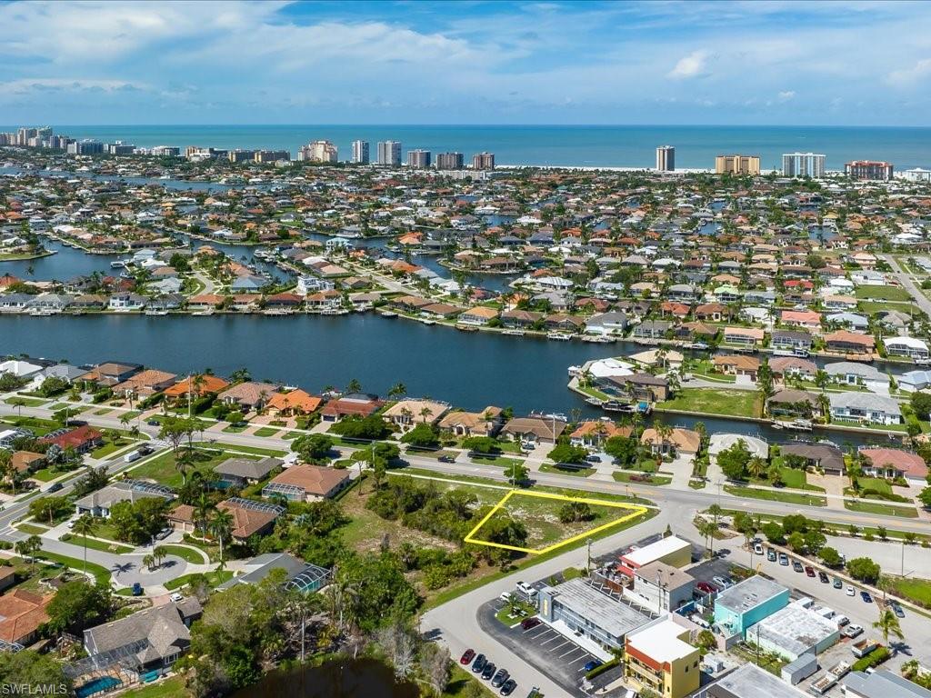Fabulous visible corner lot ideal for model home across from waterfront homes and a small commercial area. Solid ridge sand soil conditions and fairly high natural elevation. Available as single lot or  with 1127 Marco Lake Drive - the adjacent lot.