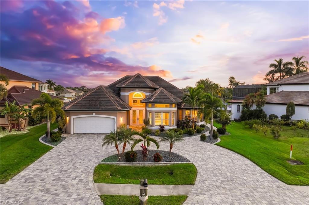 Discover a rare slice of true Southwest Florida tranquility—where every day begins and ends on the water. This home is perfectly positioned for unmatched outdoor living, offering sweeping southern-exposure water views, remarkable privacy, gorgeous sunsets, and a front-row seat to the area’s incredible wildlife. From your oversized dock, watch dolphins glide by, manatees surface, and birds gather along the shoreline. A built-in viewing window with underwater lighting turns the dock into your own personal aquarium after sunset.

The new dock, 13k-lb lift, and canopy set the stage for effortless boating. A quick, scenic ride—about 25 minutes—takes you to open water, with just one bridge boasting nearly 9 feet of clearance.

The entire outdoor area has been reimagined for relaxation: newly landscaped grounds with fresh irrigation, a resurfaced saltwater pool, new pool heater, paver pool deck, updated lanai cage, and a paver circular driveway. The lanai features an outdoor shower and a dedicated hookup for a future outdoor kitchen, ensuring this becomes your favorite place to live, entertain, and unwind.

Inside, the home is bright, open, and immaculately maintained. The split-bedroom design provides excellent privacy, while the guest bath offers direct pool access—perfect for visitors. The kitchen’s pass-through window makes outdoor dining effortless. Impact-rated windows and doors provide peace of mind, and the home is already wired for a generator.

If you’re looking for serene water views, abundant wildlife, and total comfort—inside and out—this is the paradise you’ve been waiting for.