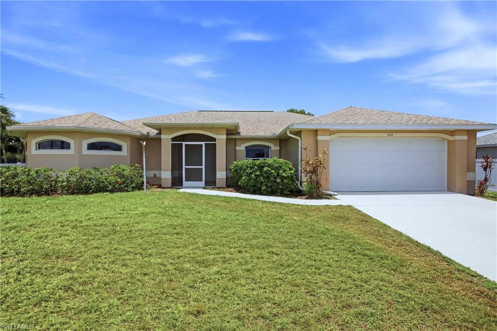 PRICED TO SELL! Spacious 3/2/2 with DEN in desirable NW Cape Coral. READY FOR MOVE IN. LARGE SCREENED LANAI and lots of sliders. This spacious home features great floor plan with NEWER STAINLESS APPLIANCES, NEW CARPET IN BEDROOMS, NEW INTERIOR AND EXTERIOR PAINT. Largest home under 300K with 1937 square feet of living. The DEN has FRENCH DOORS that open to the great room. Kitchen has LARGE BREAKFAST BAR, this spacious floor plan is great for entertaining. Master bath with GARDEN TUB and separate walk-thru shower. Roof 2023. Well and septic. No flood insurance needed.