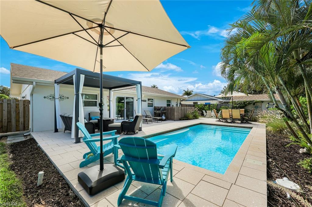 Charming stone cottage in one of Central Naples' most desirable locations, offering the perfect blend of character, modern updates, and outdoor living just under four miles from the Gulf beaches. Beautifully remodeled from top to bottom, this 3-bedroom, 2-bath residence is move-in ready and ideally situated near downtown Naples, Baker Park, the Greenway, premier shopping, dining, and entertainment.

Inside, you'll find a bright and inviting floor plan featuring wood-look tile flooring throughout, fresh interior and exterior paint, impact-resistant windows and doors, a new roof (2026), updated electrical panel, and new 220-amp service. The stylish kitchen has been thoughtfully redesigned with white cabinetry, sleek countertops, a colorful tile backsplash, and newer appliances, including an LG refrigerator with a glass beverage door. A split-bedroom layout provides privacy, while both bathrooms have been tastefully renovated, including a beautifully tiled shower in the primary suite.

Step outside to your own private tropical oasis. The professionally landscaped and fully fenced backyard is designed for relaxation and entertaining, featuring a sparkling heated pool, expansive Shell Stone pool deck, and a louvered pergola that creates the perfect shaded retreat. Southwest rear exposure provides abundant sunshine throughout the day, making this an ideal setting for enjoying the Naples lifestyle year-round. A large storage shed offers additional flexibility and could easily serve as a workshop, storage space, or future pool house.

With no HOA, no rental restrictions, and no pet restrictions, this property offers exceptional freedom and flexibility. There's ample room for a boat, trailer, or oversized vehicles, making it equally appealing as a primary residence, seasonal getaway, or investment opportunity. Located within a highly sought-after neighborhood known for excellent schools, sidewalks, playgrounds, basketball courts, tennis and pickleball facilities, and surrounded by multi-million-dollar homes, this is a rare opportunity to own a beautifully updated home in the heart of Naples.