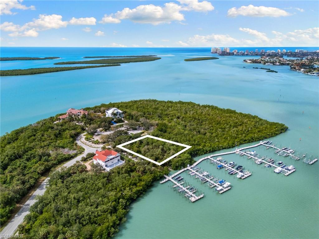 Welcome to Key Marco, an exclusive island community on Marco Island, Florida. This vacant lot offers breathtaking sunset views, perfect for building your dream home. Experience one-of-a-kind island living with the added privacy of a gated entrance and private gym to your beautiful oasis. A boat dock membership is included with your purchase and is conveniently located in your backyard. The boating lifestyle is easy when you live in the luxurious Key Marco community. Call to day for a showing.