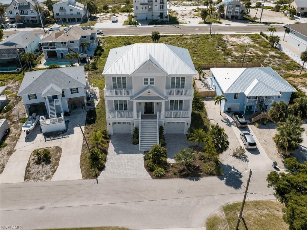 One or more photo(s) has been virtually staged, AI generated or rendered.  An exceptional opportunity awaits on the peaceful south end of Fort Myers Beach in the highly desirable Laguna Shores community. This oversized 74' x 127' cleared homesite offers significantly more room than many neighboring parcels, creating a rare and flexible canvas for a custom coastal residence, seasonal retreat, or long-term island sanctuary.

One of the most appealing features of Laguna Shores is its effortless connection to the Gulf. Residents enjoy two deeded beach access points, placing the sugar-white sands and turquoise waters of Fort Myers Beach just a short stroll away. Whether your ideal day includes shelling, swimming, fishing, watching dolphins, or simply enjoying a sunset over the Gulf, the beach is never far from home.

The location also offers a compelling blend of privacy and convenience. Tucked into a quieter residential pocket of the island, Laguna Shores provides a relaxed neighborhood atmosphere while remaining close to the growing energy of the south end. Nearby Santini Plaza continues to come alive with farmers markets, coffee shops, boutiques, dining, and new redevelopment that is adding momentum and renewed appeal to this part of Fort Myers Beach.

Beyond the island, the location makes it easy to enjoy the best of Southwest Florida. Bonita Springs, Naples, and RSW International Airport are all within convenient reach, offering access to world-class dining, shopping, entertainment, cultural attractions, and seamless travel.

With its generous dimensions, cleared condition, deeded beach access, and prime south-end setting, this is more than just a vacant lot — it is an opportunity to create a custom home in one of Fort Myers Beach’s most inviting coastal communities.