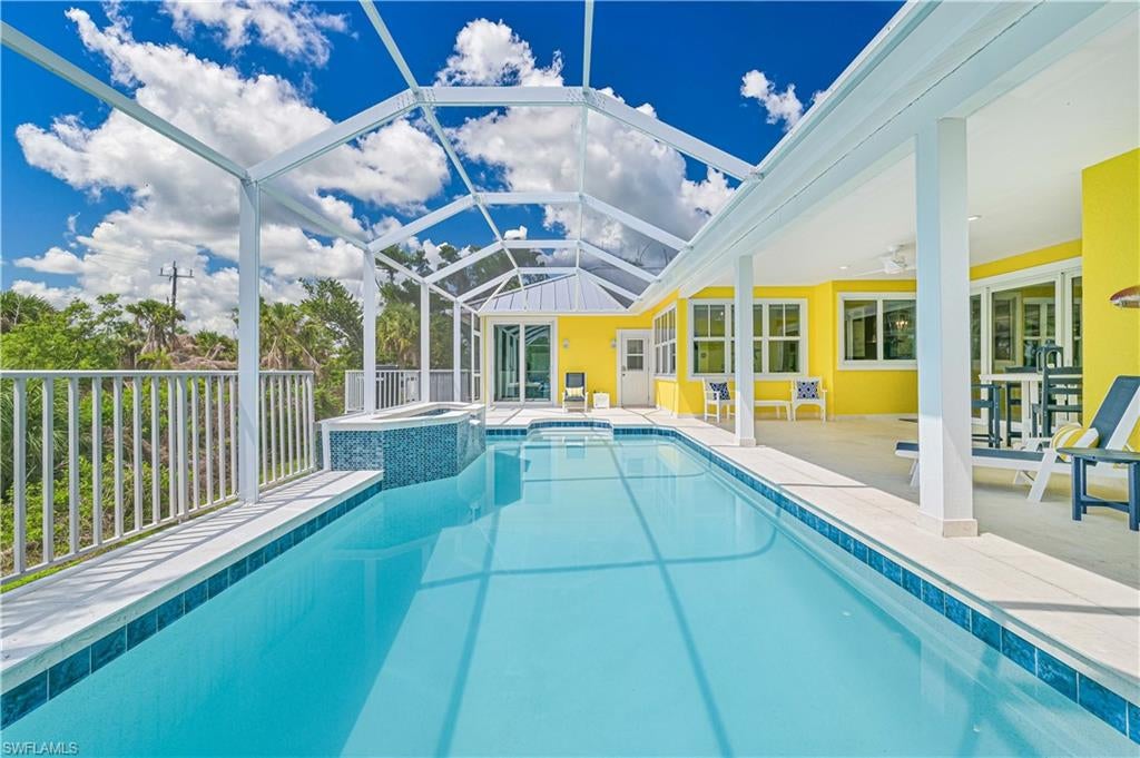 Completely renovated from top to bottom and reimagined with uncompromising attention to detail, this exceptional near-beach Sanibel Island residence is essentially brand-new construction. Designed to blend effortless coastal elegance with modern luxury, this 5 bedroom / 7 bath home offers an extraordinary combination of comfort, sophistication, and functionality. Every element has been thoughtfully curated, from the floor plan to the high-end finishes and designer furnishings to the gourmet chef’s kitchen featuring every conceivable amenity perfect for entertaining family and guests alike. Offering five to six bedrooms (den is convertible to a bedroom) and seven bathrooms, this spacious home can accommodate up to 12 guests and includes two luxurious primary suites while every guest bedroom features its own en-suite custom bath, creating the ultimate retreat for family and visitors. Additional upgrades and amenities throughout (too many to list here) include impact-resistant windows and doors, all-new electrical, new air conditioning and plumbing systems, a brand-new metal roof, whole-house generator, professional landscaping with irrigation, a custom outdoor firepit, and a private resort-style saltwater pool and full laundry room with double washers and dryers provide the ultimate convenience for both everyday living and vacation hosting. No detail was overlooked in the transformation of this remarkable property. Ideally situated in the heart of Sanibel Island on a rare and private 1.2-acre parcel, the home is just a short walk or bike ride to Sanibel’s world-renowned beaches, miles of scenic bike paths and conveniently close to charming restaurants and boutique shopping. Whether envisioned as a private family compound, luxury second home, or premier income-producing vacation rental with strong established revenue history, 335 Cowry Court represents a truly rare island opportunity. Offered fully furnished, turnkey, and move-in ready.  This is Sanibel luxury living at its finest.