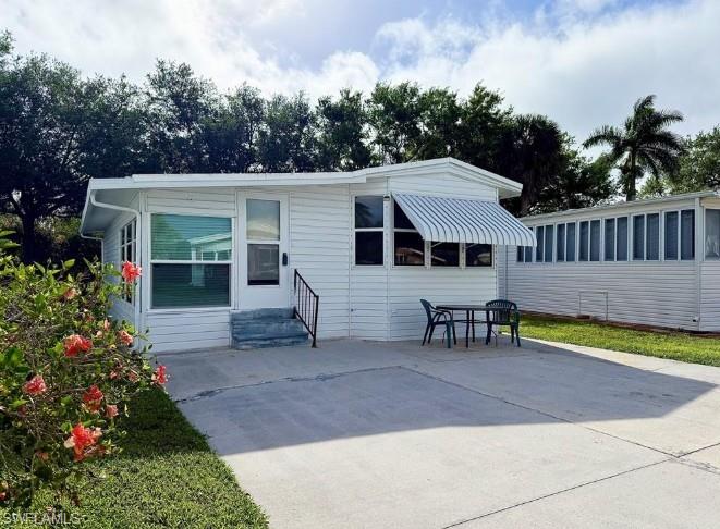 Excellent location! Affordable Living! Plus, YOU OWN the LAND! Thank you for viewing 5 Bass Lane in Imperial Wilderness Condominium Association---a gated 55+ community that is conveniently located! It is approximately 2 miles to shopping and restaurants, 8 miles to Marco Island beaches, and 10 miles to Naples beaches. This 2Br/1.5Ba home offers a spacious kitchen, living room with a sleeper-sofa, and furnishings that stay. Since 2024 the following updates occurred: stainless-steel appliances, A/C, vinyl roof-over, siding, some windows, some flooring, and the LR ceiling fan. The HOA fee of $898. per quarter is very reasonable and covers many of your needs: water, lawn care, basic cable, trash/recycling, and community amenities. Community amenities include the following: 2 pools with spas, bocce, pickleball, pétanque, tennis, shuffleboard, billiards, ping pong, a library, clubhouse, dog parks, and an extremely active events calendar!