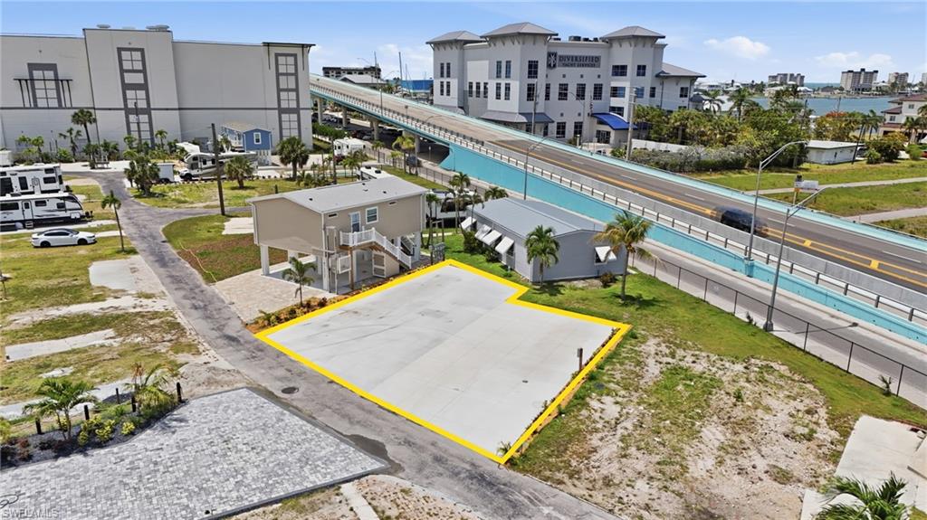 Welcome to Gulf Cove Trailer Park Co-Op, a rare opportunity to own two side-by-side lots in one of San Carlos Island’s hidden waterfront communities just moments from Fort Myers Beach. Lots 32 and 33 are being offered together as a package deal, creating an oversized footprint rarely available within this highly sought-after 55+ co-op community. Completely paved with updated landscaping already in place, the property offers a clean, low-maintenance setup ready for immediate enjoyment or future redevelopment. Located at the gateway to Fort Myers Beach, Gulf Cove places you near marinas, waterfront dining, boating, fishing, entertainment, and the island lifestyle Southwest Florida is known for. Ownership within Gulf Cove includes a 1/60th interest in the entire co-op community, creating a unique blend of private ownership and community-oriented waterfront living on San Carlos Island. Gulf Cove is a gulf-access oriented waterfront community, with the Board of Directors currently working through a future process for boat slip assignments. Throughout the community, residents enjoy bay, marina, and water views along with the convenience of being surrounded by ongoing redevelopment and investment in the Fort Myers Beach area. Major infrastructure improvements have already been completed throughout the community, including sewer, water, and electric services. The expansive paved configuration of these combined lots creates flexibility for RV/Park Model use, outdoor entertaining, parking, or future elevated residential construction. Future homes within Gulf Cove are required to meet current FEMA elevation standards, generally requiring construction approximately 8–10 feet above grade. This opens the door for elevated coastal home concepts with open-air entertaining areas, covered parking, storage, or additional outdoor living space below. The double-lot setup provides additional design flexibility that is difficult to find within the community and may allow for expanded custom home concepts or multiple structures subject to approvals. Quarterly HOA fees of approximately $800(per parcel) include lawn and land maintenance, sewer, water, trash removal, street maintenance, and community upkeep, helping keep ownership simple and manageable. Whether you are looking for a seasonal retreat, RV getaway, future island home site, or long-term investment within a revitalizing waterfront community, Lots 32 and 33 offer a unique opportunity to secure a larger presence in one of Southwest Florida’s most desirable coastal locations.