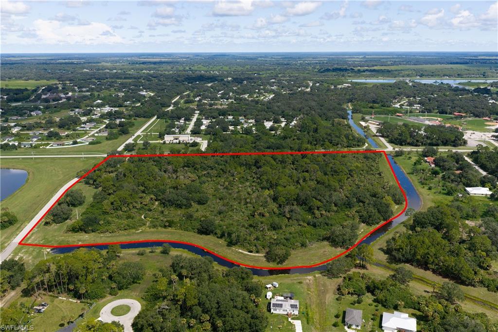 Exceptional development opportunity in Port LaBelle! This expansive 20.5 acres Vacant residential property offers tremendous potential for builders, developers, and investors. The property features extensive canal frontage and convenient access from Cowboy Way and Collingswood Parkway. Surrounded by established residential areas, this large tract provides an exciting opportunity for a future residential development or investment project.