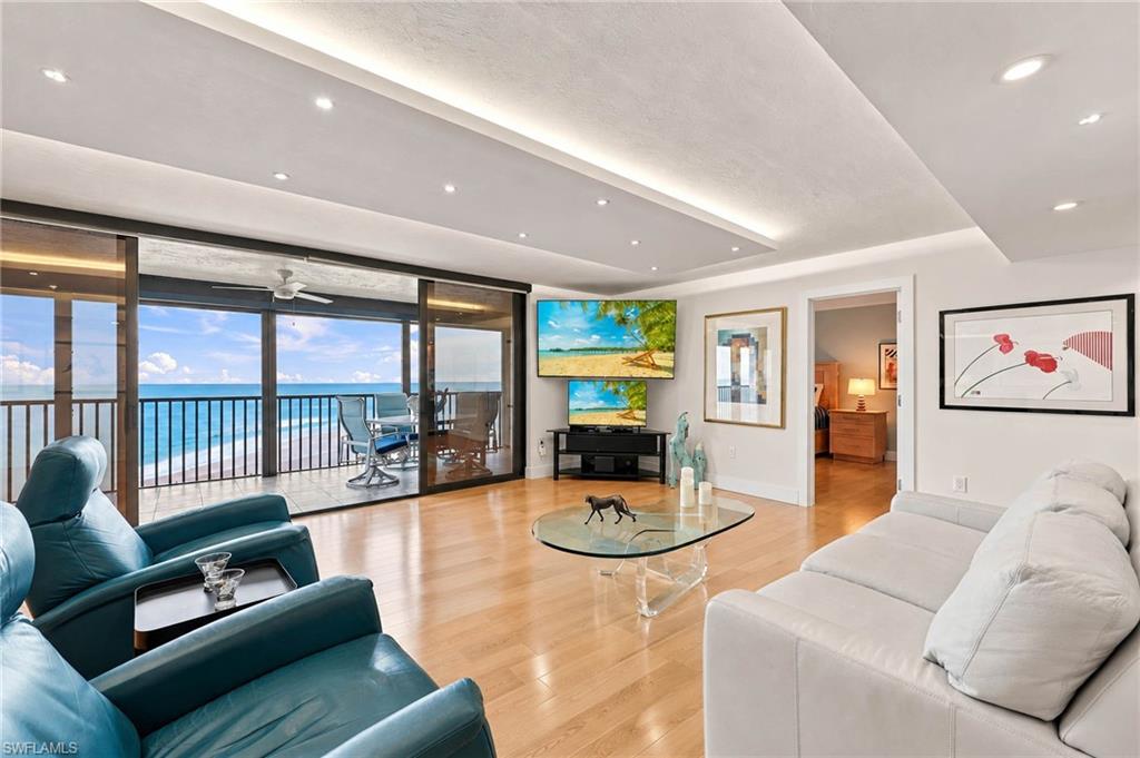 Welcome to your ultimate beachfront escape at Casa Grande on Vanderbilt Beach. This stunning, fully renovated 2-bedroom, 2.5-bathroom condo offers the perfect blend of coastal elegance and modern luxury, designed to make you feel right at home the moment you step inside.

The open living space is anchored by the gorgeous, top of the line Anderson natural blonde maple floors, high baseboards, and solid-core shaker doors. In the living room, a dropped light box ceiling with custom LED lighting creates a warm, inviting ambiance for relaxing after a day in the sun. If you love to entertain, you’ll appreciate the custom wet bar, complete with its own sink and wine fridge. 

Steps away, the chef’s kitchen is fully equipped with premium LG Studio stainless steel appliances, granite countertops, Kohler double-deep sinks, and custom solid maple cabinetry with convenient soft-close drawers and pull-outs. Grohe polished chrome fixtures and mounted TVs are featured throughout the home.

The guest bedroom is incredibly versatile, featuring a custom-built Murphy bed system with integrated drawers and its own en-suite bathroom. Speaking of bathrooms, all of them have been beautifully remodeled, showcasing stunning rainfall tile and frameless glass enclosures. There is also a stylish half-bath off the main living area for guests.

Thoughtful upgrades abound, including new LED lighting, a brand-new electrical panel, a newer A/C unit with a Honeywell thermostat, and Hunter Douglas remote-controlled privacy shades. For peace of mind, the condo is also equipped with new hurricane shutters. Plus, you’ll have your own separate, air-conditioned storage locker—perfect for storing your beach gear and pool toys.

Living at Casa Grande puts you right in the heart of Vanderbilt Beach, just minutes from the area's top dining, shopping, and entertainment. On-site, you'll love having a private beach access, a spacious heated pool, and hassle-free guest parking right across the street. The building itself has been recently refreshed with a new roof, new exterior paint, and a new secure elevator. Plus, the community room is currently being upgraded with new furniture, a big-screen TV, and a workout nook featuring a stationary bike and elliptical.

Of course, the real highlight is the breathtaking, unobstructed view of the Gulf, offering front-row seats to spectacular Florida sunsets every single night. 

Your paradise awaits!