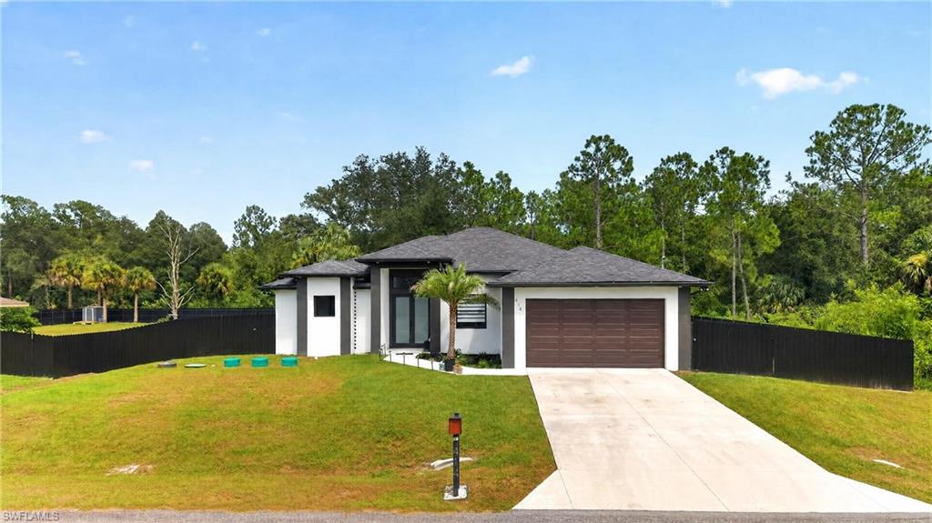 Built in 2025 and offering over 1,800 square feet of living space, this beautiful home sits on approximately half an acre and is fully fenced, providing exceptional space, privacy, and flexibility.

The interior features marble-look tile throughout, modern finishes, warm light-wood accents, and a bright open layout. A spacious den provides additional flexibility for a home office, playroom, media room, or lounge area.

The primary suite offers a relaxing retreat with an ensuite bathroom featuring a soaking tub and walk-in shower. Additional features include a two-car garage with epoxy flooring, a dedicated laundry room with built-in cabinetry and utility sink, and a covered lanai ideal for enjoying Florida evenings.

The oversized fenced yard provides ample room for outdoor enjoyment, recreational equipment, additional vehicles, or creating your own private outdoor retreat.

A great opportunity for tenants looking for a newer home with modern finishes, additional land, and significantly more outdoor space than a typical rental.