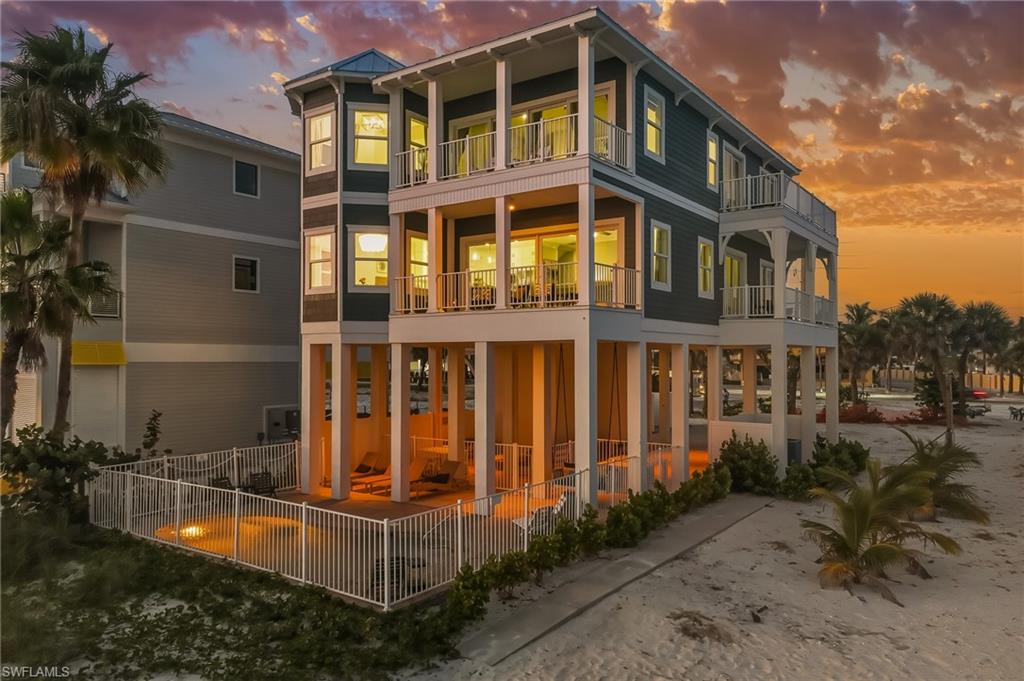 Experience beachfront bliss at this 5-bedroom, 4-bath home tucked along Fort Myers Beach’s desirable north end. Perfectly positioned on the Gulf of Mexico, this residence delivers sweeping views of the turquoise waters and soft ocean breezes that drift through its bright, open interior.

Step outside and you’re moments from the island’s best — Margaritaville, MoJoe’s Coffee Café, and a variety of local restaurants and shops — yet the home’s peaceful setting feels worlds away. As the day winds down, gather on the private balcony to watch the sunset paint the sky in golden tones — a nightly reminder of life well-lived by the sea.

Fully updated and thoughtfully designed, the home pairs coastal relaxation with refined comfort. The sellers have completely refreshed and redecorated the interior, giving every space a crisp, modern feel. The chef-inspired kitchen includes stainless steel appliances, a convenient pot-filler, quartz counters, and a sunny breakfast nook with front-row Gulf views.

Quality upgrades are everywhere: Hardie-Board siding, new windows, decorative corbels, and a modern pool fence highlight the craftsmanship. A standing-seam metal roof, new HVAC systems, pool heater, and equipment were all added in 2023, followed by a whole-home in-duct air purifier in 2024 for enhanced comfort.

Inside, cohesive coastal tones flow throughout new flooring, paint, and décor. Each bedroom opens to a balcony where the sound of rolling waves sets a tranquil mood. Three updated bathrooms feature sleek walk-in showers, while a fourth includes a classic tub-shower combo.

Whether you envision a full-time beach retreat, a seasonal getaway, or a lucrative vacation rental, 70 Avenue E delivers on every level — a place where Gulf-front living, modern design, and island convenience meet in perfect harmony.