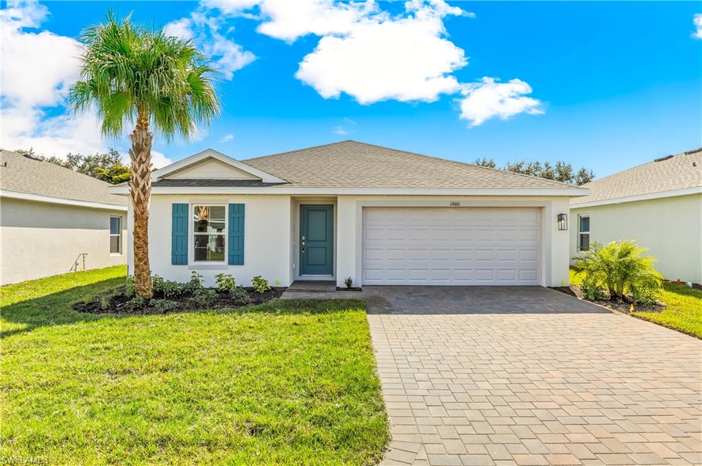 One or more photo(s) has been virtually staged, AI generated or rendered.  New construction estimated September completion.  New Fort Myers Community.  Experience Florida Living in this Light & Bright Gated Community Home!
Welcome to your spacious 5-bedroom, 2-bathroom, 2 car garage oasis, perfectly situated within a desirable, and private gated community off the popular and historic Buckingham Road. This charming 1,708 sq. ft. residence is filled with natural light and designed for comfortable, modern living.

Step inside to discover an inviting, open floor plan that flows seamlessly throughout the main living areas. The bright kitchen and living spaces provide the perfect backdrop for daily life and entertaining guests. With five generously sized bedrooms, there’s plenty of room for a growing family, a home office, or a hobby room, the possibilities are endless!
Just some of the Included designer finishes are Whirlpool Stainless Steel appliances, quartz countertops, Mohawk LPV flooring in living areas,  paves in the driveway, walkway and patio,  Smart home package.  

Outdoor Paradise:
Step outside to your expansive backyard—a blank canvas ready for your personal touch. Whether you envision a lush garden, a play area for children, or the perfect spot for weekend barbecues, this large outdoor space is sure to become your favorite retreat.

Prime Location:
Enjoy the peace of mind that comes with living in a gated community, combined with the convenience of a prime location. You’ll be near top-rate schools and a variety of shopping options, making every day errands a breeze. The historic Buckingham Road offers a unique blend of tranquility and accessibility to local amenities.

This home offers a perfect blend of space, comfort, and location. Don’t miss your chance to own a piece of this sought-after community!