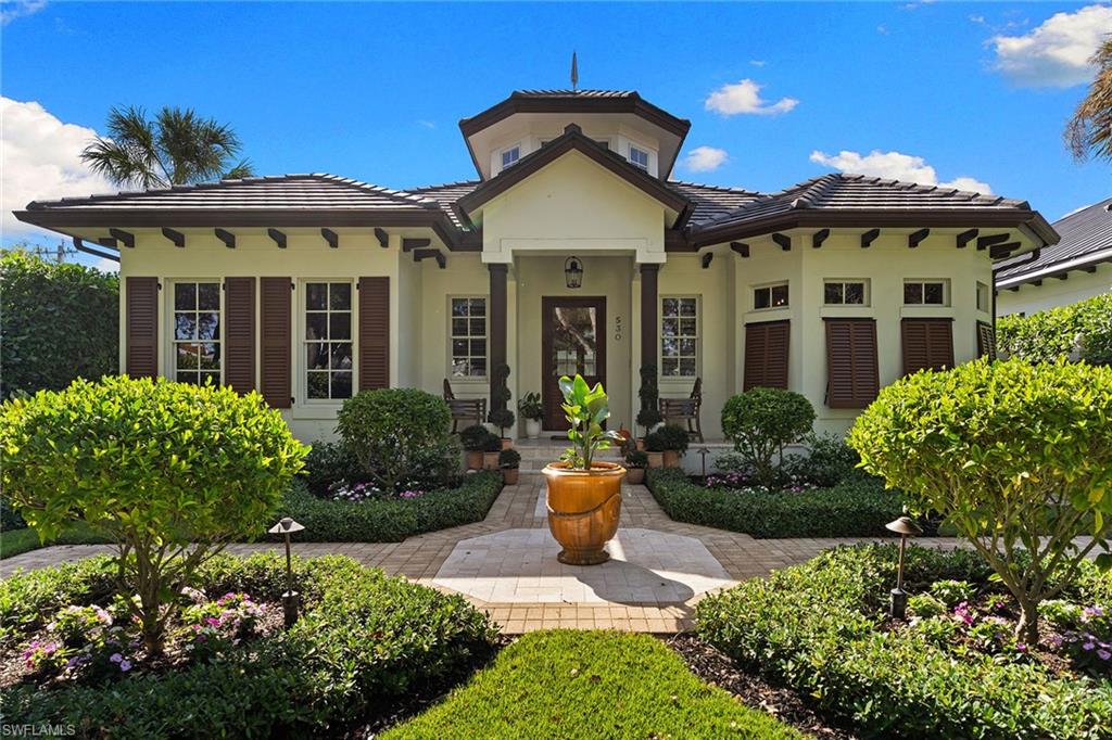 A private sanctuary of timeless elegance, where thoughtful architecture and tranquil outdoor living come together in one of Old Naples’ most desirable settings. Custom built by Waterside Builders for its original owners, this beautifully appointed residence offers three bedrooms plus a den, blending sophisticated design with effortless coastal comfort. Refined interiors and inviting living spaces create an atmosphere of understated elegance throughout. Two distinct outdoor living areas offer exceptional opportunities for relaxation and entertaining, complemented by a peaceful pool setting that serves as a private retreat surrounded by tropical beauty. An air-conditioned three-car garage, discreetly accessed from the rear alley, provides exceptional convenience while preserving the home's attractive streetscape. Ideally situated on a high-and-dry homesite within Flood Zone X500, outside the high-risk Special Flood Hazard Area, this exceptional property offers an additional measure of peace of mind. Located along coveted 1st Avenue North, the residence provides convenient access to Naples’ pristine beaches, world-class dining, and the celebrated boutiques of Fifth Avenue South and Third Street South. A distinctive opportunity to experience the charm, privacy, and effortless lifestyle of Old Naples.